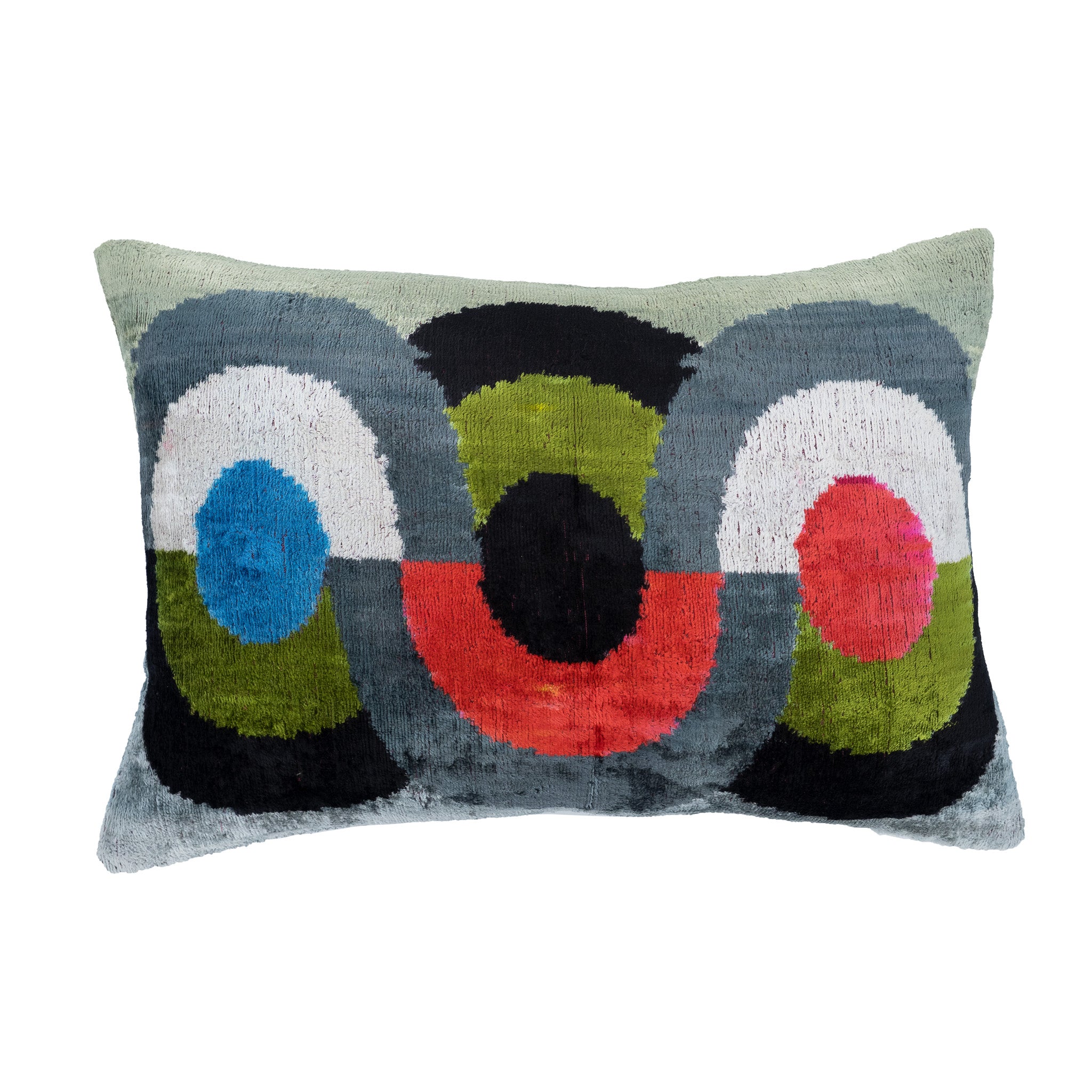 Trinity ikat throw pillow in bold circular color blocks of red, blue, green, and black.