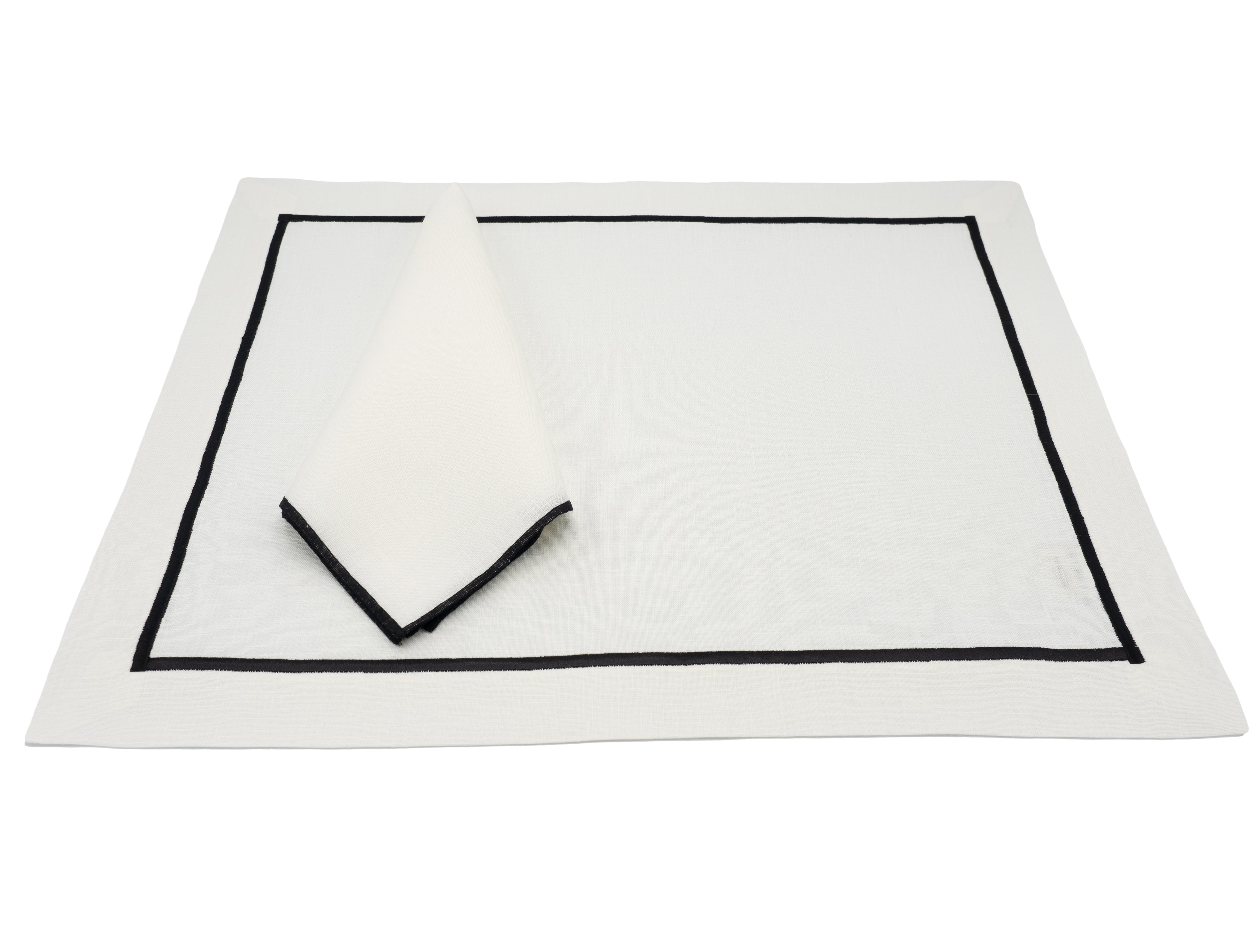 High-quality handmade linen placemats with black stitched borders, perfect for both casual and sophisticated meals.