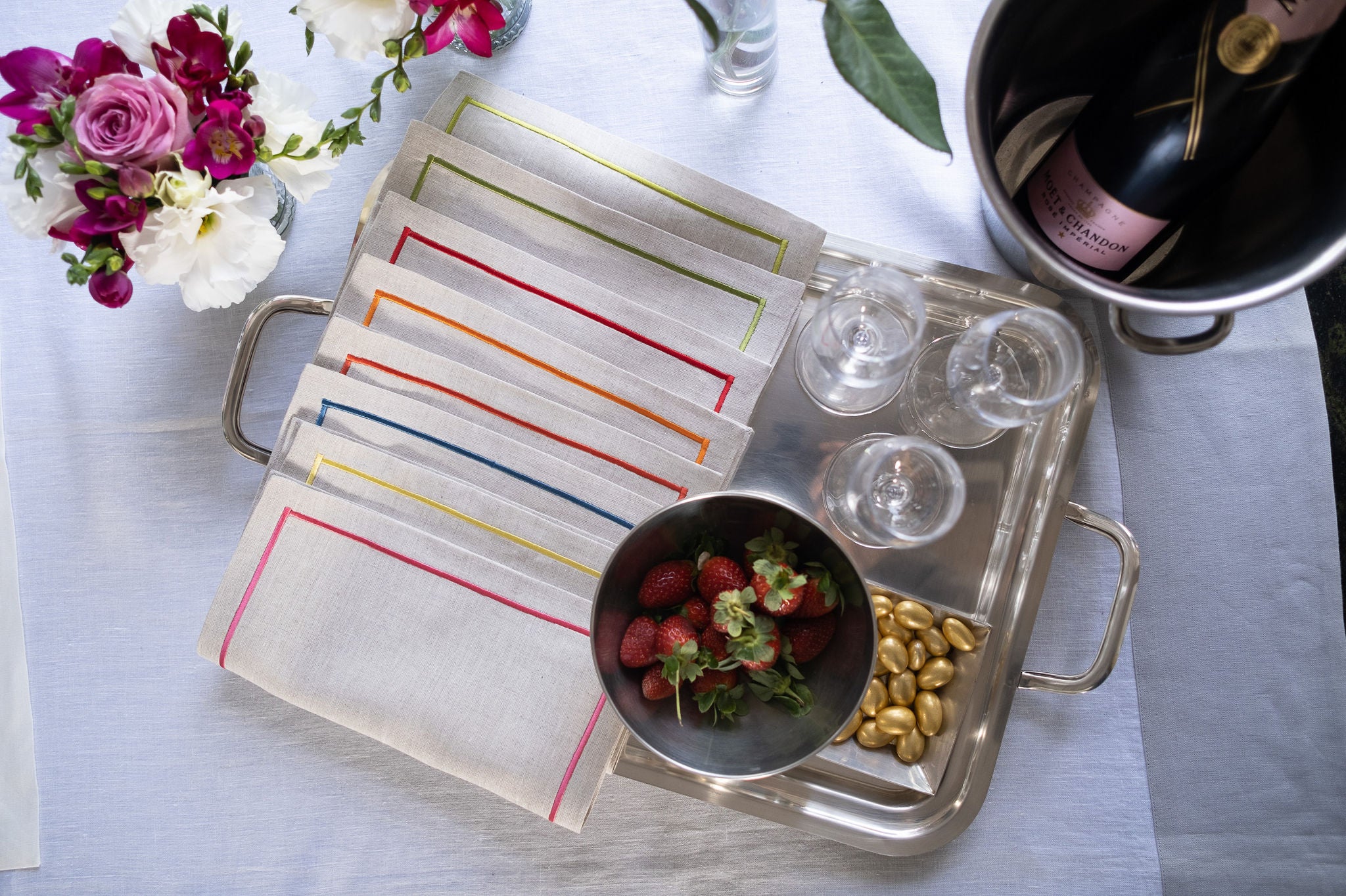 Set of 4 embroidered linen cocktail napkins, 11x11 inches, perfect for chic and sophisticated entertaining.