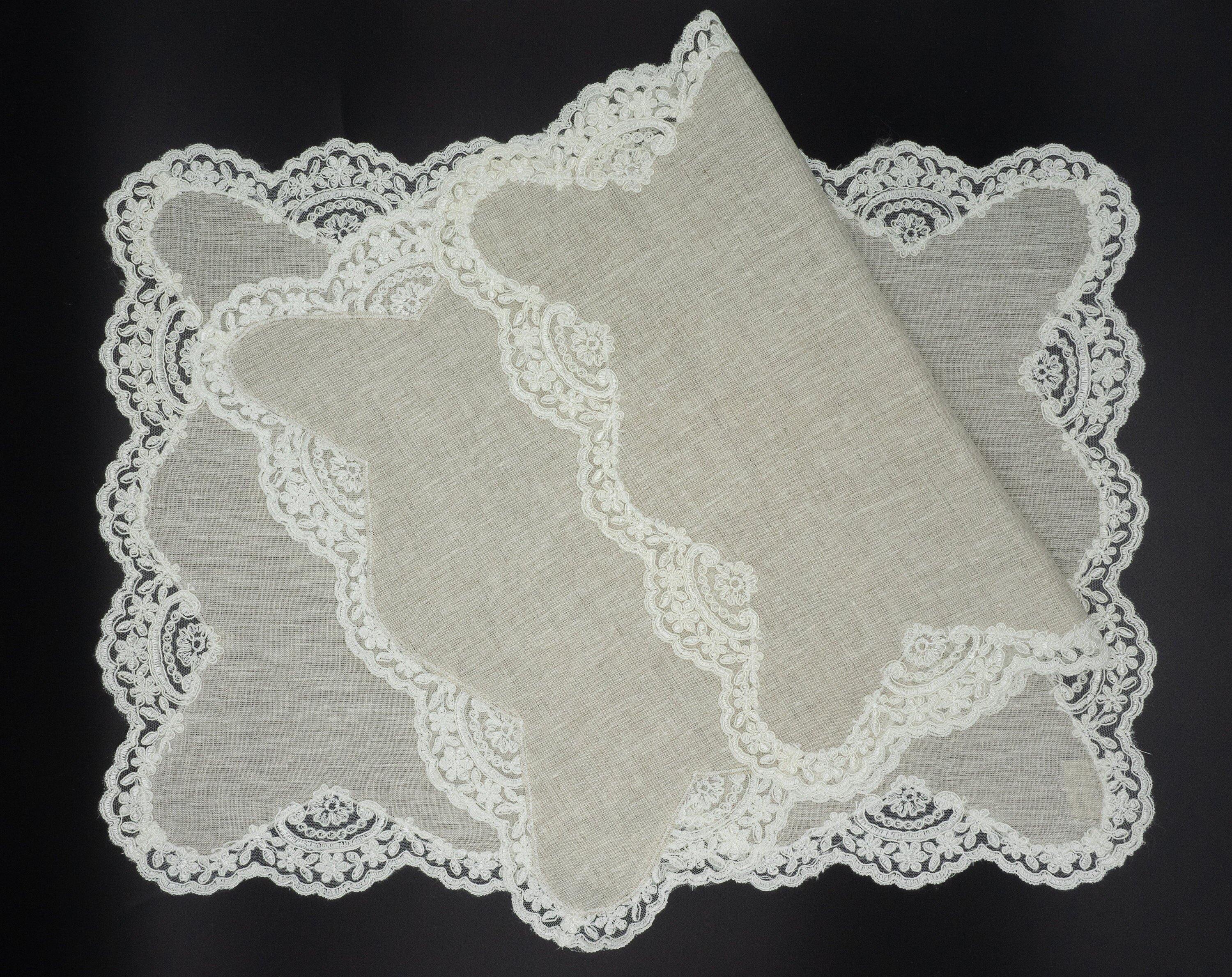 Handmade linen placemats with delicate lace borders, set of 4, crafted for elegance and durability on your dining table.