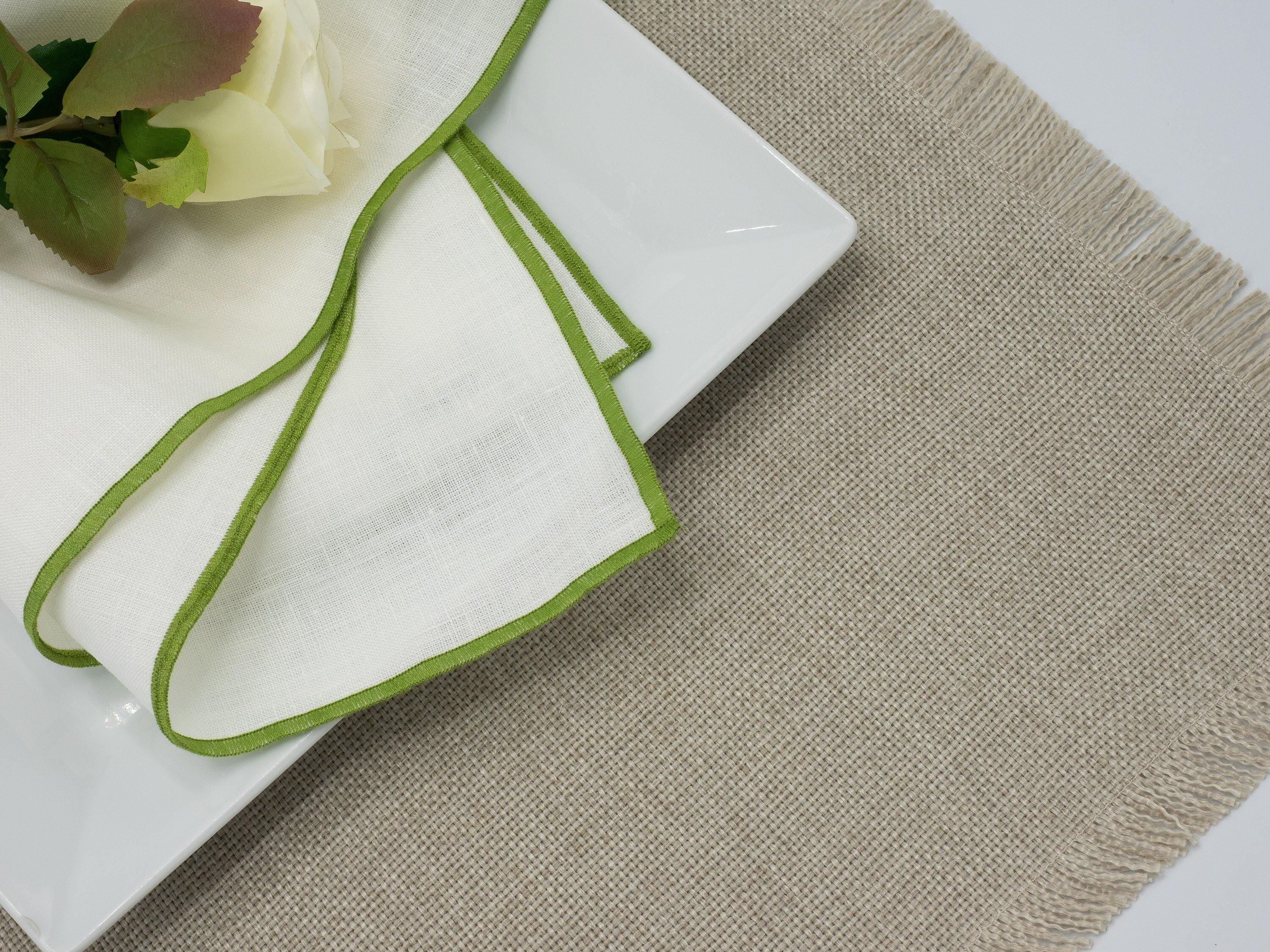 Handmade beige placemats with fringes, set of 4, crafted from cotton and polyester, machine washable for easy maintenance.