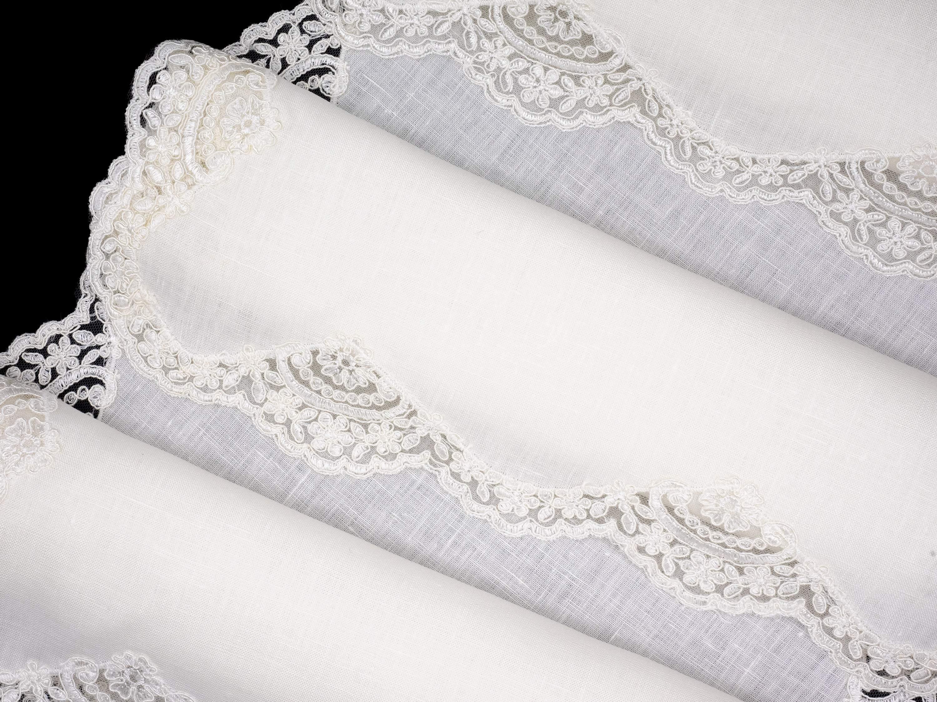 Set of 4 white linen placemats with lace borders, ideal for enhancing any dining occasion with their timeless elegance.