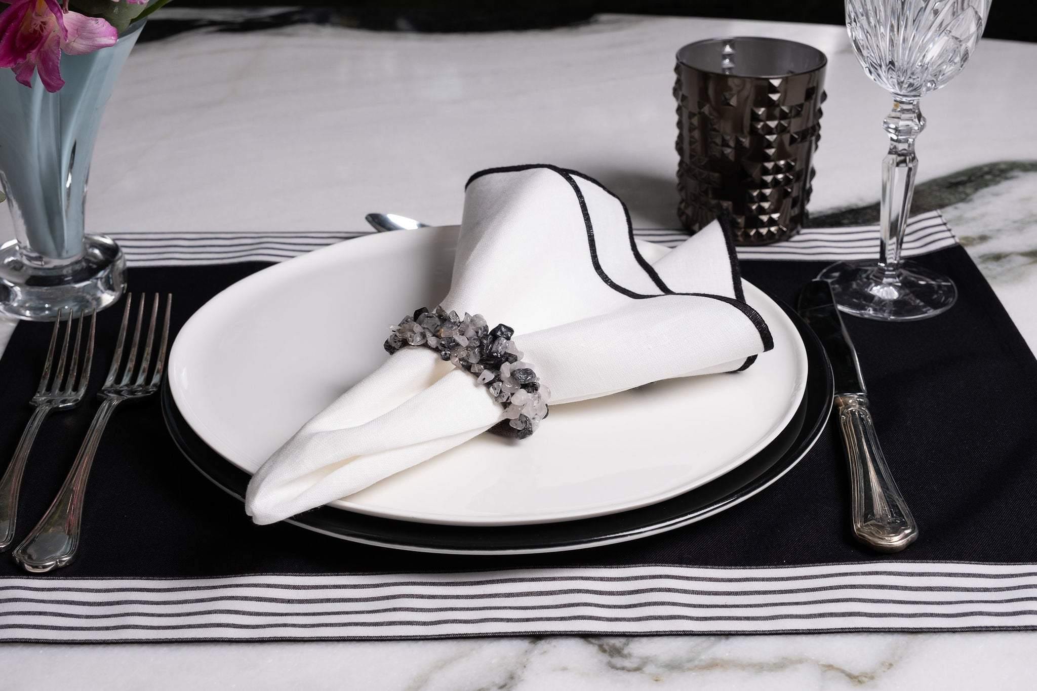 Stylish black placemats with top and bottom stripes, set of 4, easy-care, machine washable, and anti-wrinkle.
