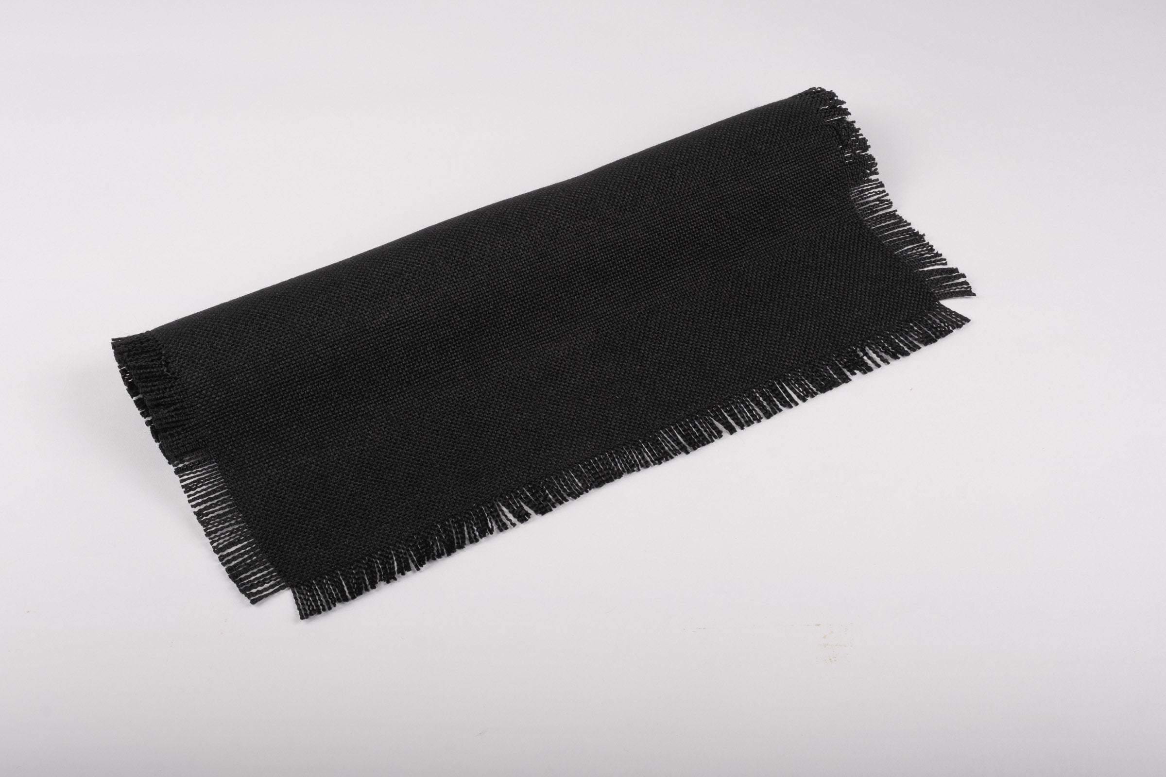 ChouChou Touch black placemats with fringes, set of 4, perfect for holiday dinners or everyday use, made from durable cotton and polyester.