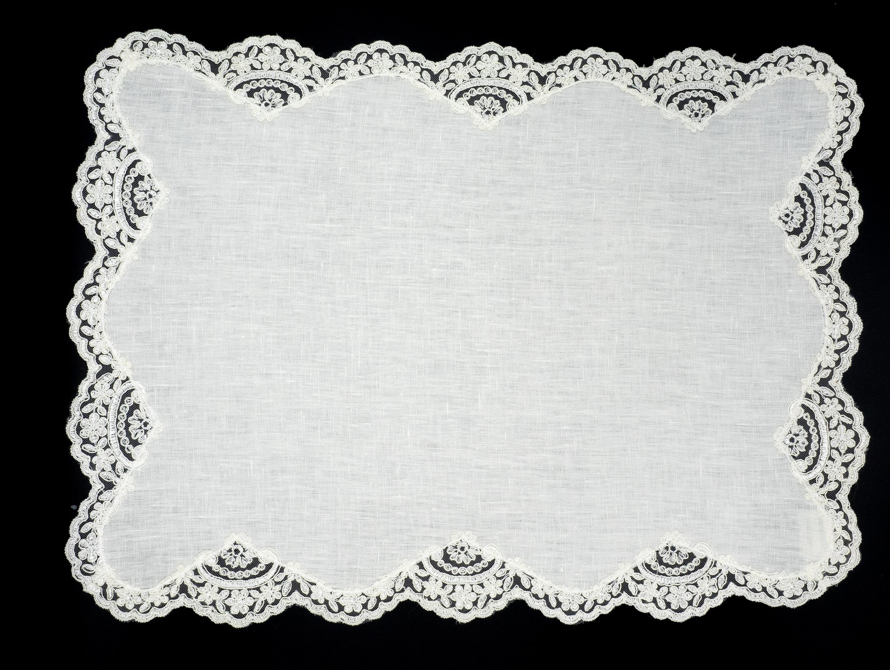 Elegant white linen placemats with lace borders, 16" x 22", set of 4, crafted to enhance your dining experience.
