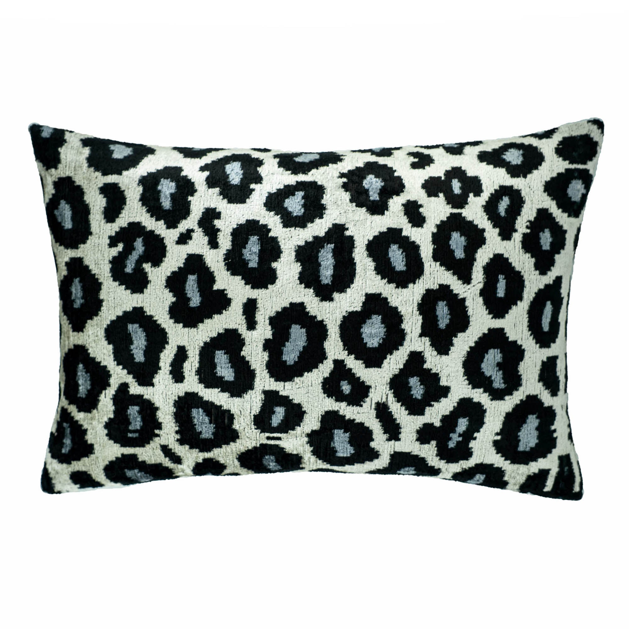 Chouchou Touch silk velvet pillow cover with a modern twist on traditional Ikat weaving and animal patterns.
