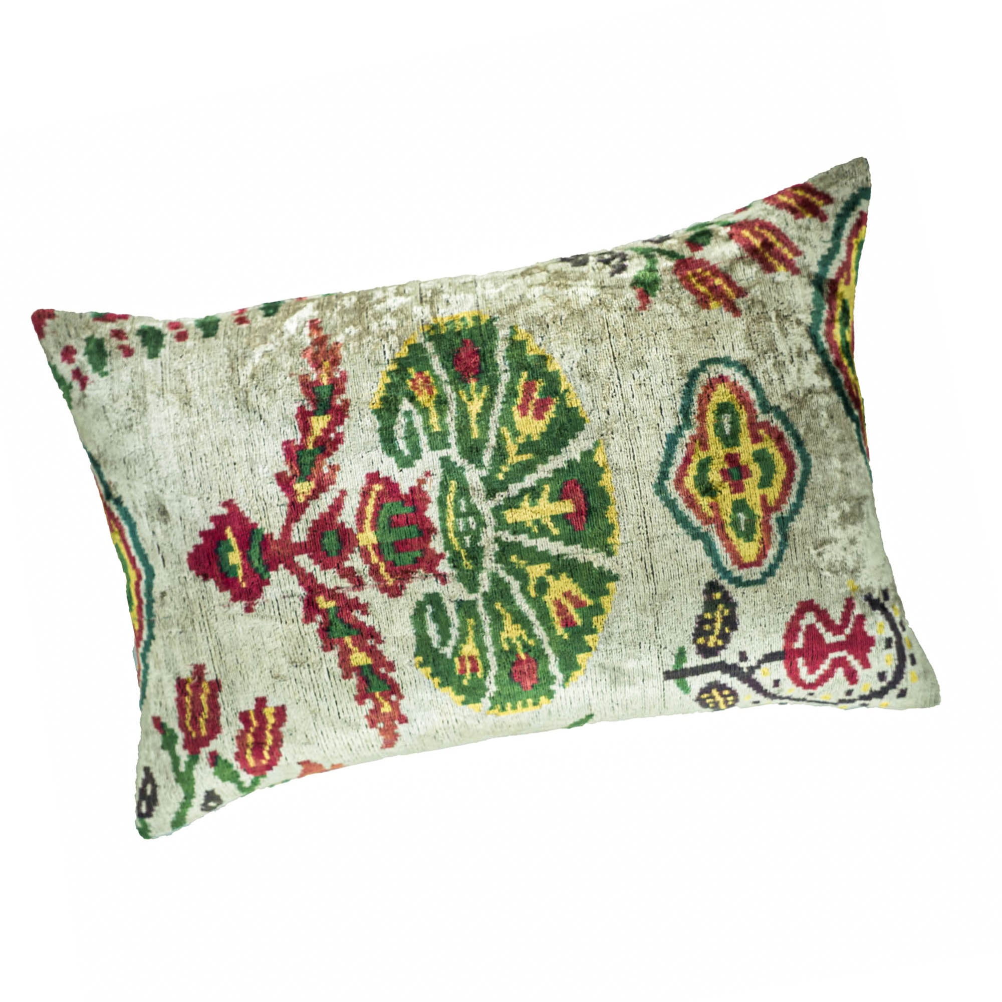 Carnations silk velvet throw pillow by Chouchou Touch, showcasing traditional Ikat weaving in bold floral motifs.
