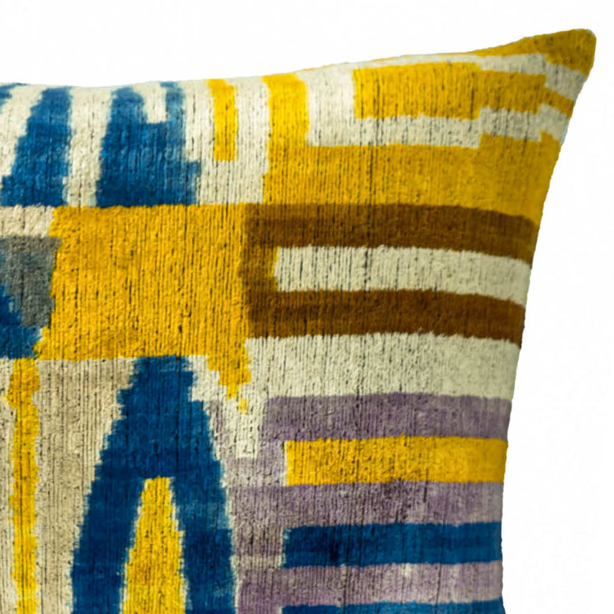 Chouchou Touch Catwalk pillow cover in silk velvet, featuring abstract stripe patterns in striking shades of yellow, blue, and brown.
