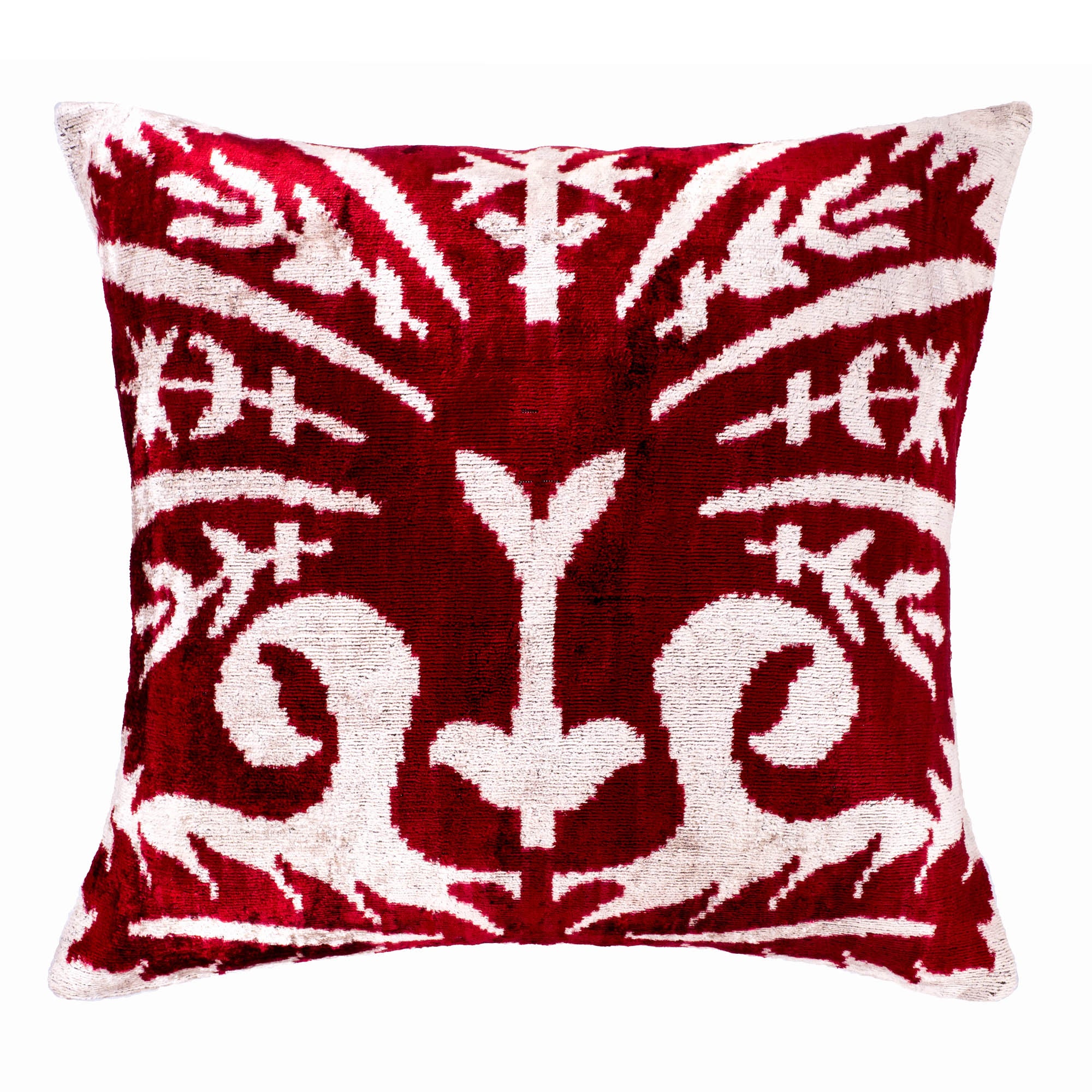 Handcrafted silk velvet Ikat pillow with intricate red and white design, inspired by Uzbek weaving traditions.
