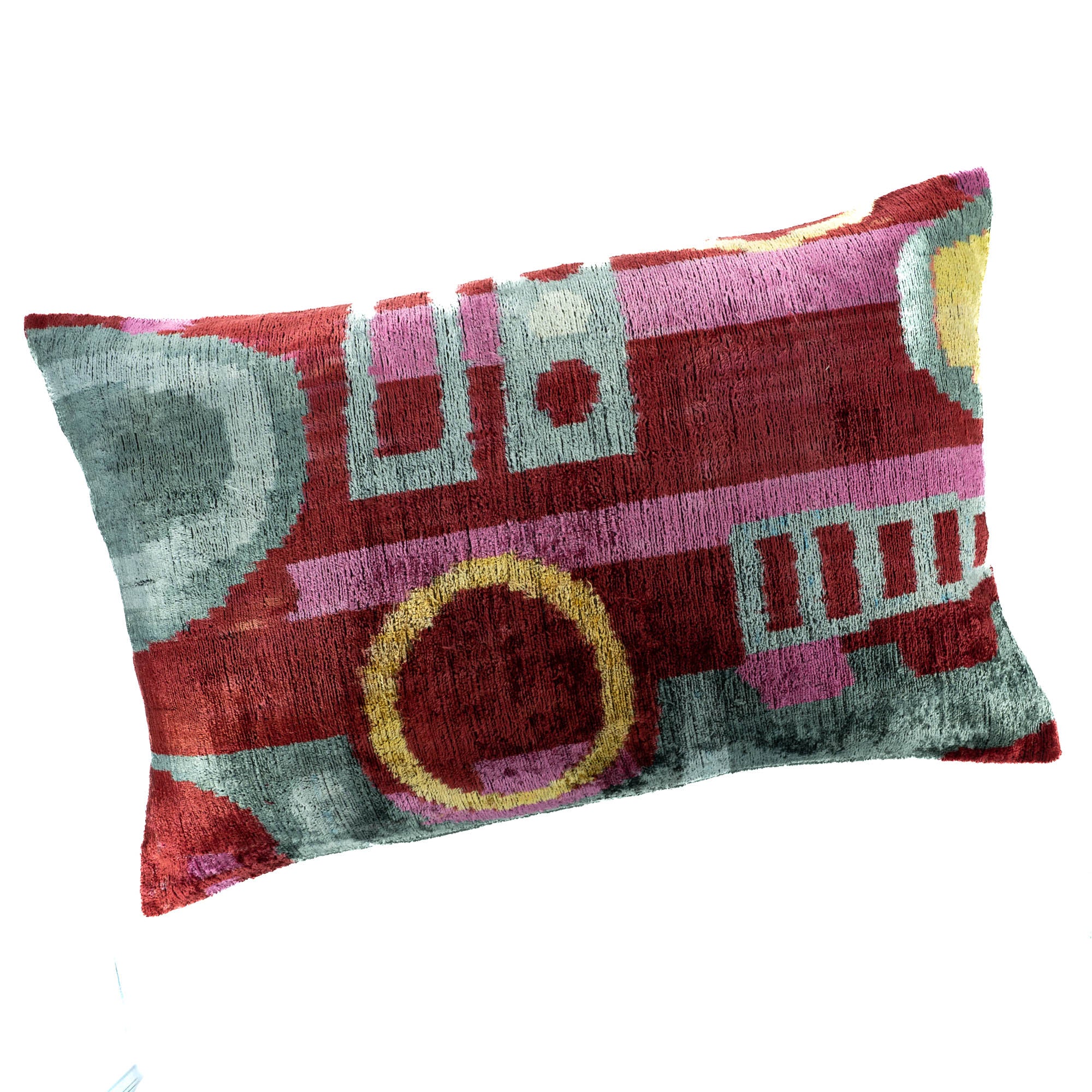 Handmade Ikat pillow with intricate geometric shapes in multicolor hues, crafted from luxurious silk velvet.
