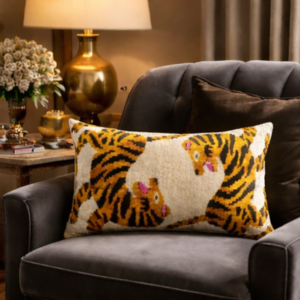 Handcrafted Bengali silk velvet accent pillow displayed on a luxury armchair in an elegant living room setting.