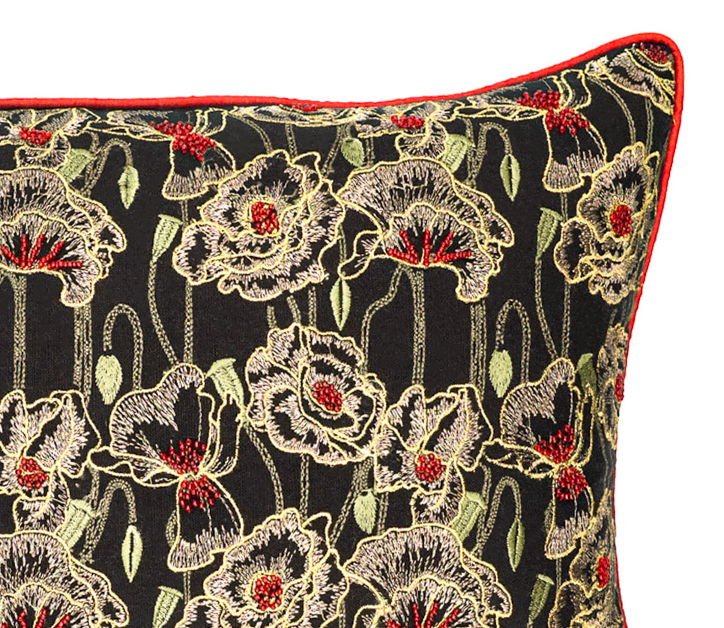 Close-up of black orchid floral linen pillow cover with intricate embroidery and red piping detail