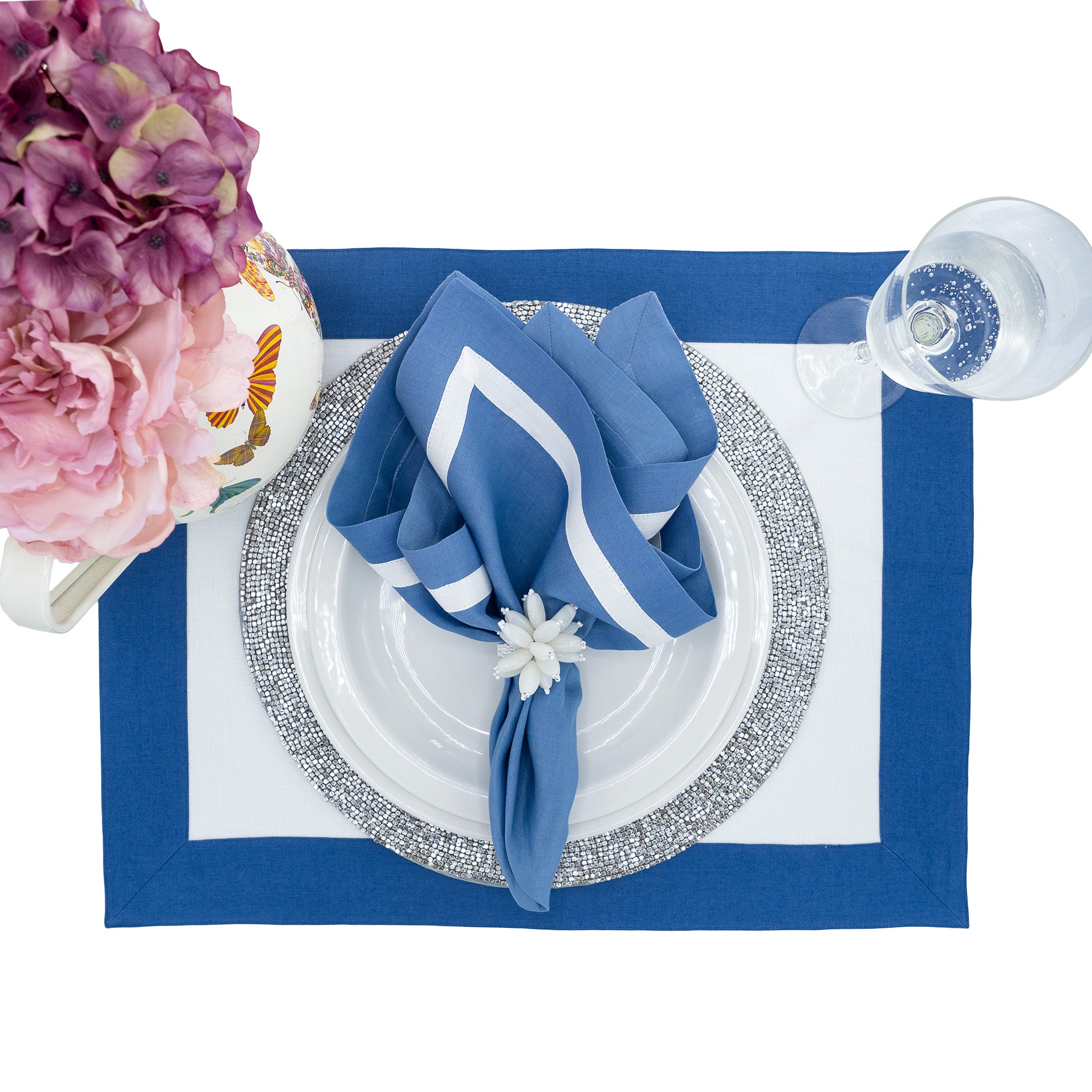 Chouchou Touch handmade blue linen napkins with white borders, perfect for enhancing both special occasions and everyday meals.