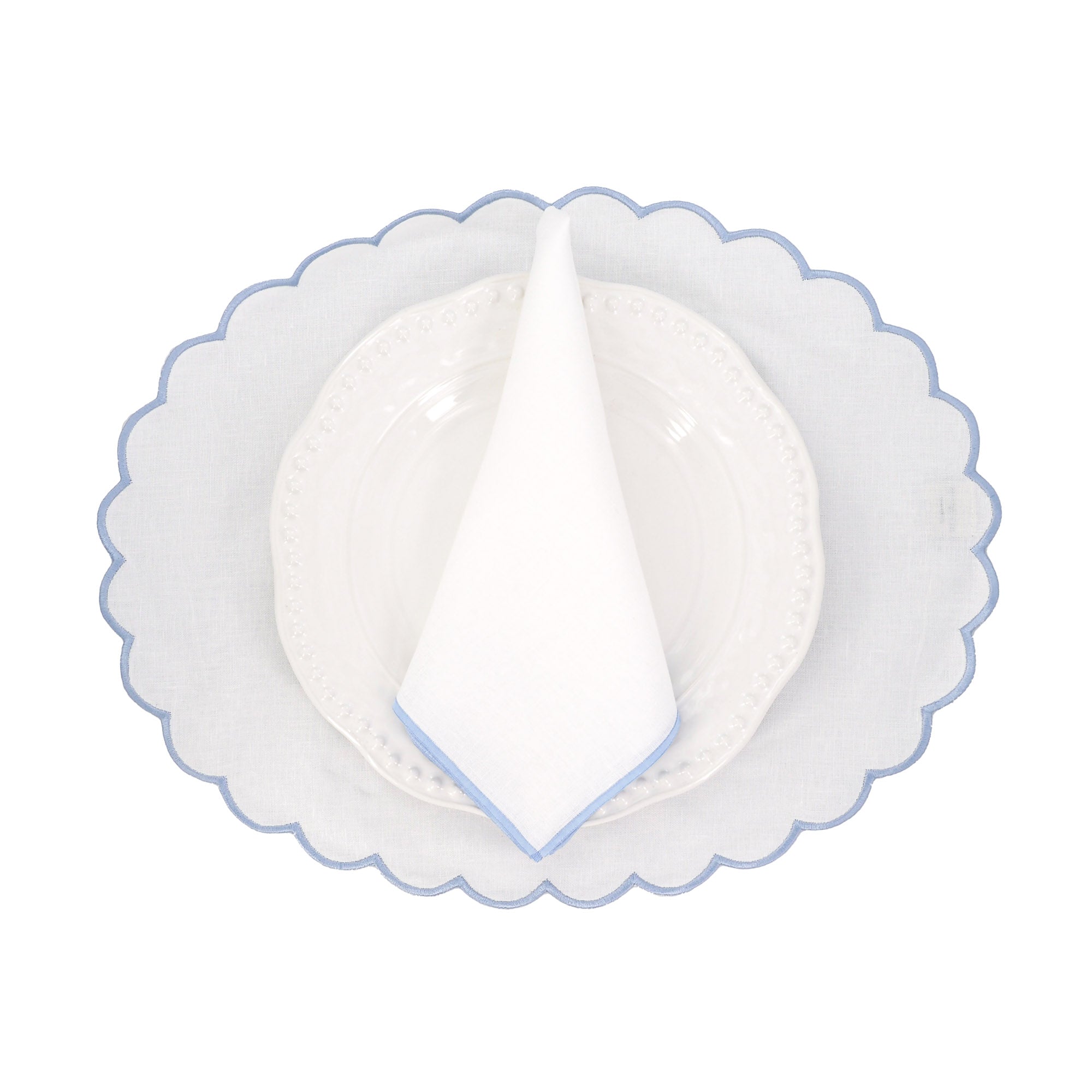Handcrafted elliptic blue linen placemat with scalloped edge - soft, durable, and beautifully detailed to bring touch of sophistication to any table setting.