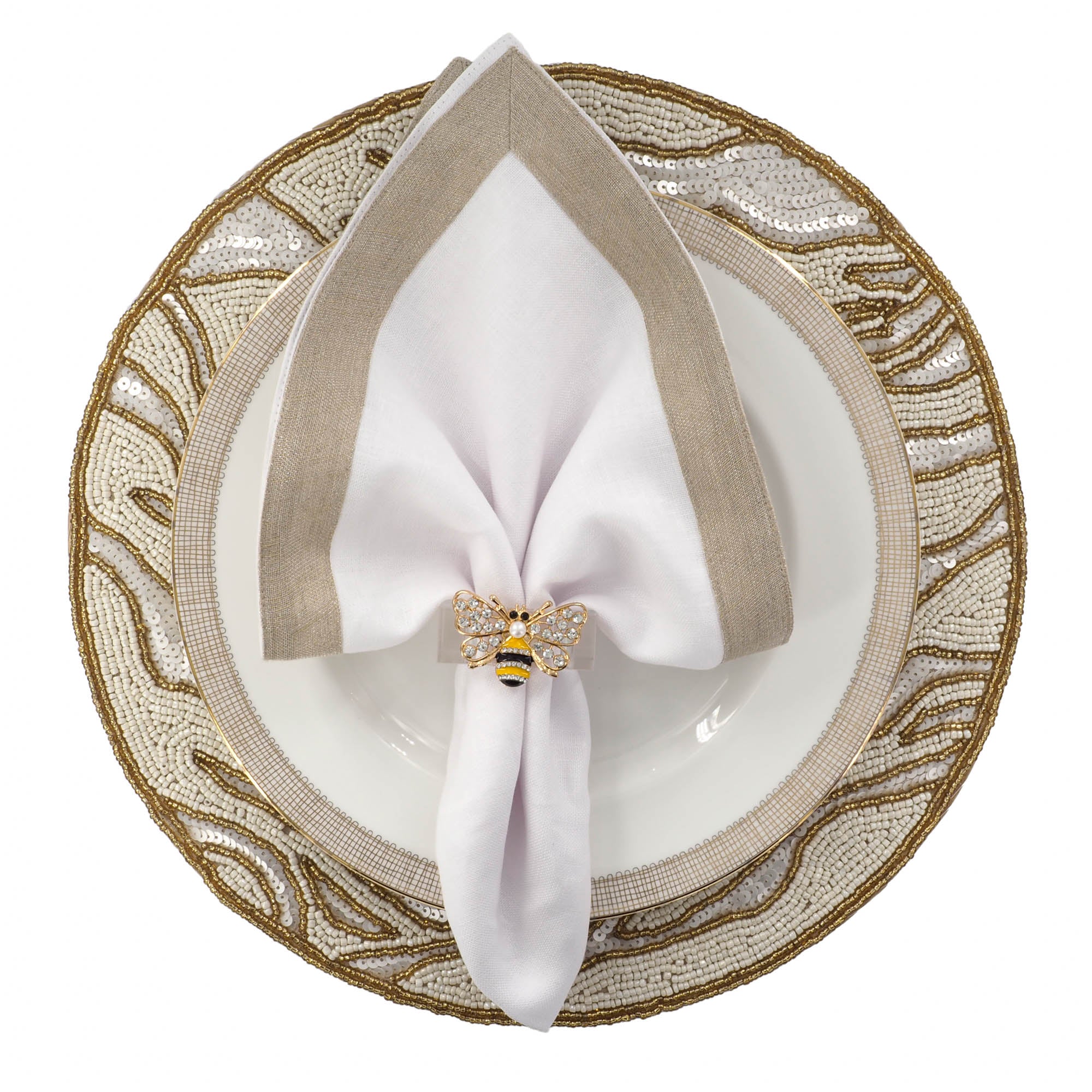 Luxury table setting featuring handmade gold and ivory beaded placemat with white linen napkin and gold cutlery by ChouChou Touch