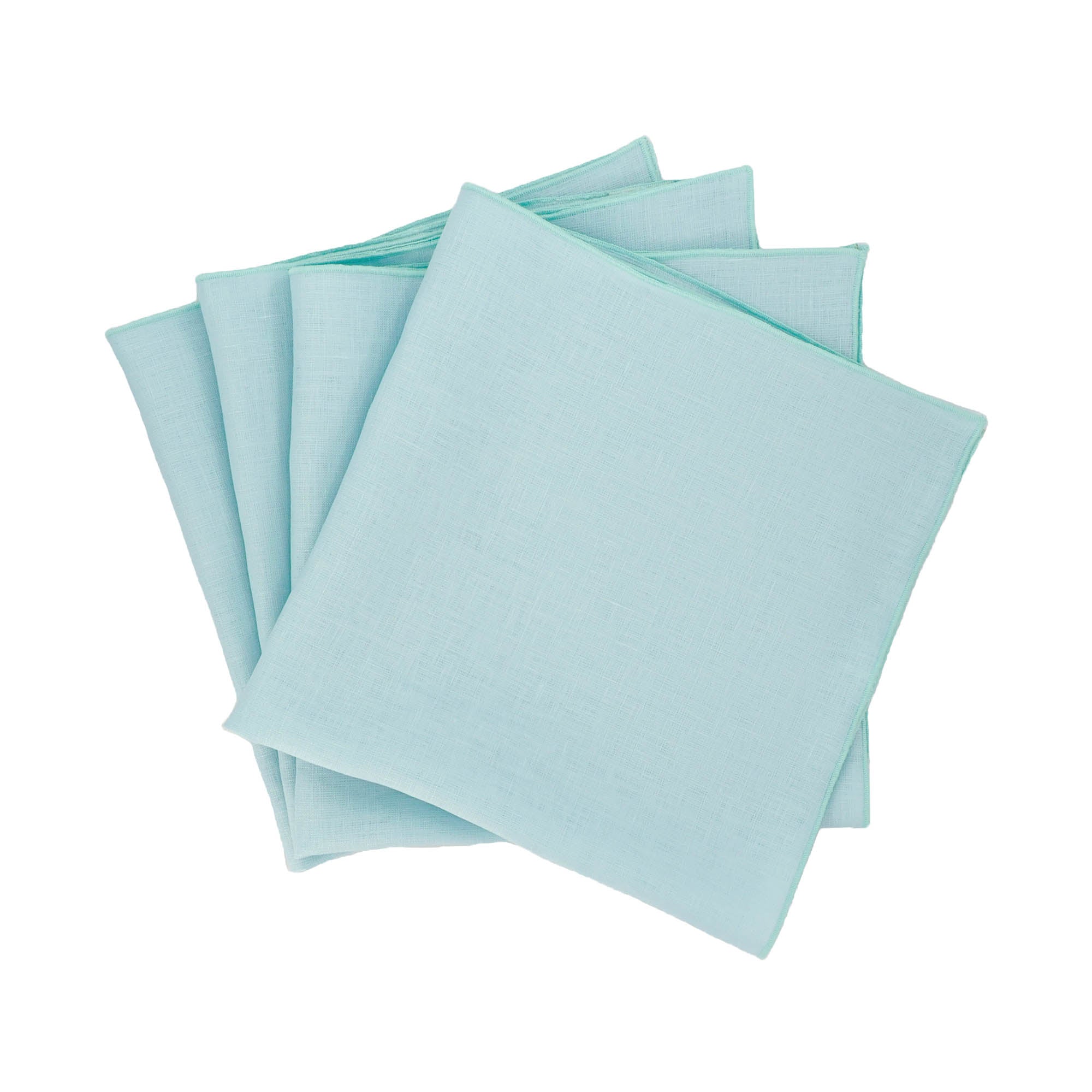 set of four light green linen napkins for elegant dining table