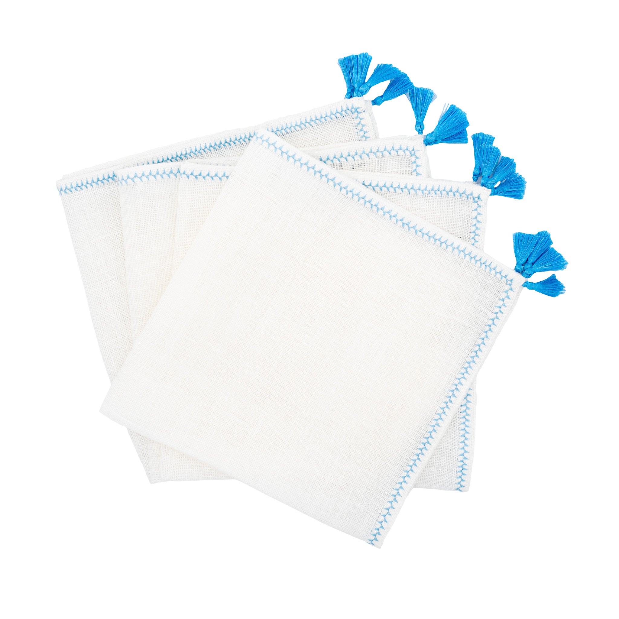 Set of 4 linen napkins with blue tassels, handmade for a stylish and elegant table setting.