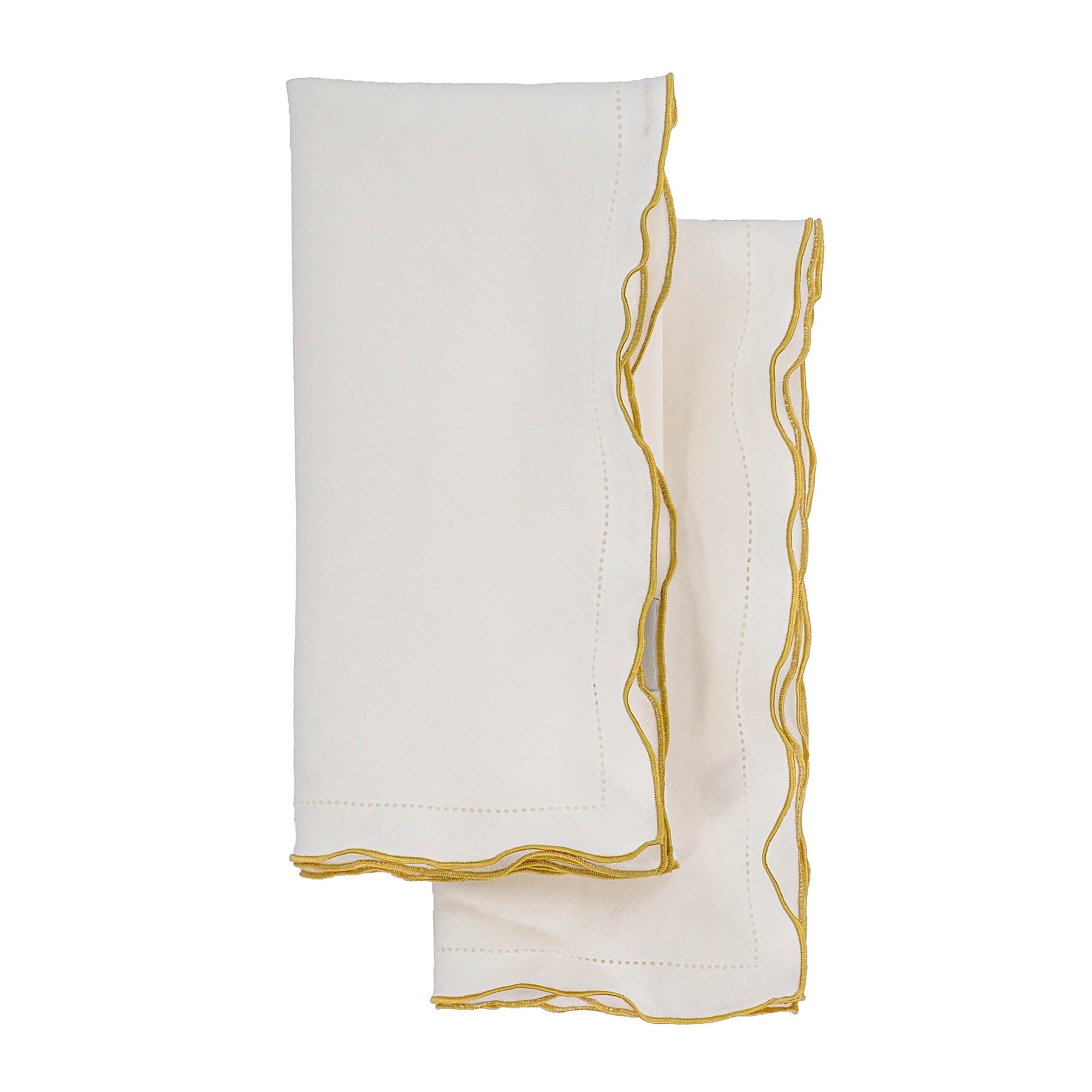 Elegant linen napkins with gold ruffled edges, handmade for lasting quality and tactile enjoyment.