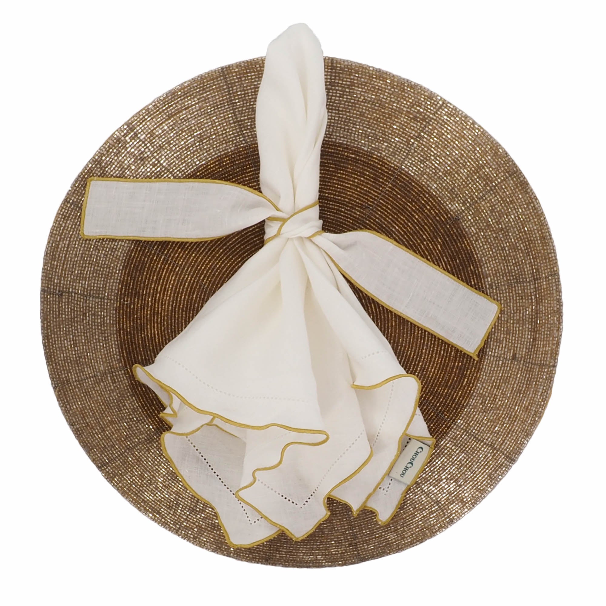 Durable linen napkins with decorative gold hemstitching, machine washable for easy care and enduring charm.