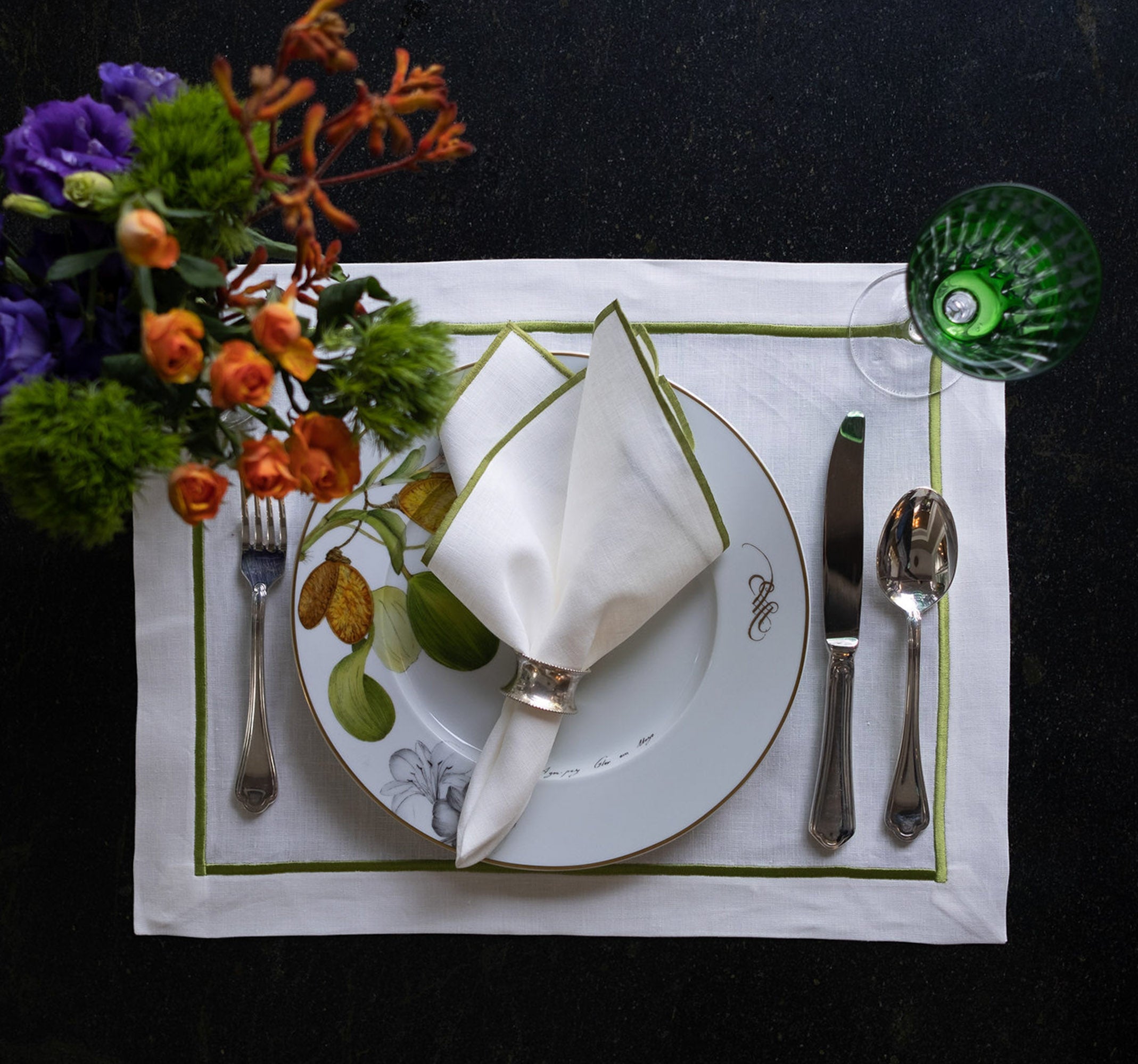 ChouChou Touch handmade white linen napkins with green stitch edges, perfect for enhancing both special occasions and everyday meals.