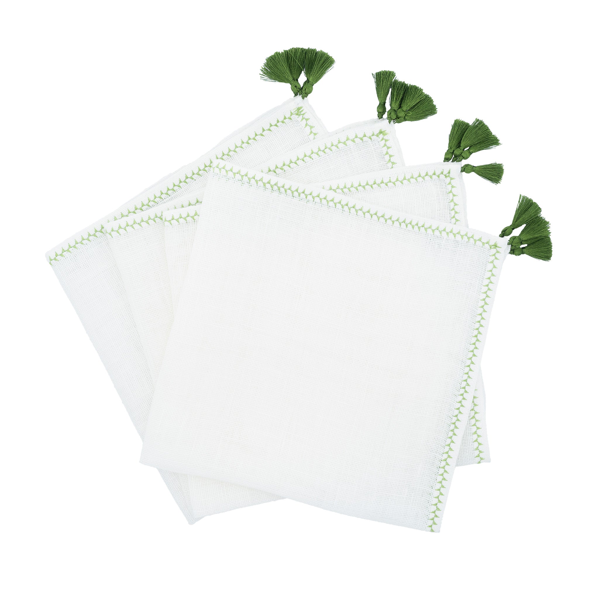 Handmade linen napkins with decorative green tassels, perfect for both casual family gatherings and formal events.