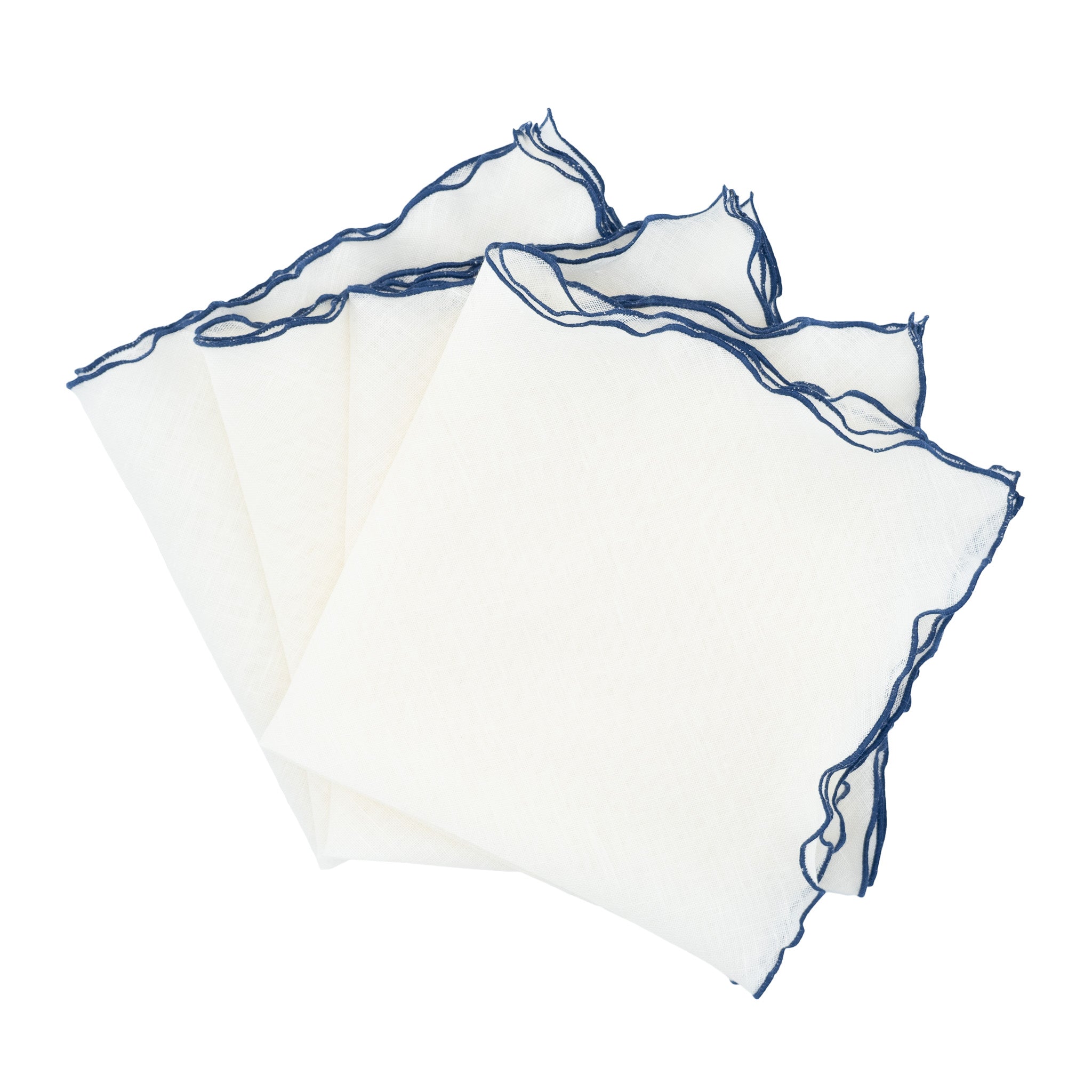 Set of 4 linen napkins with navy ruffled edges, handmade for a refined and elegant table setting.