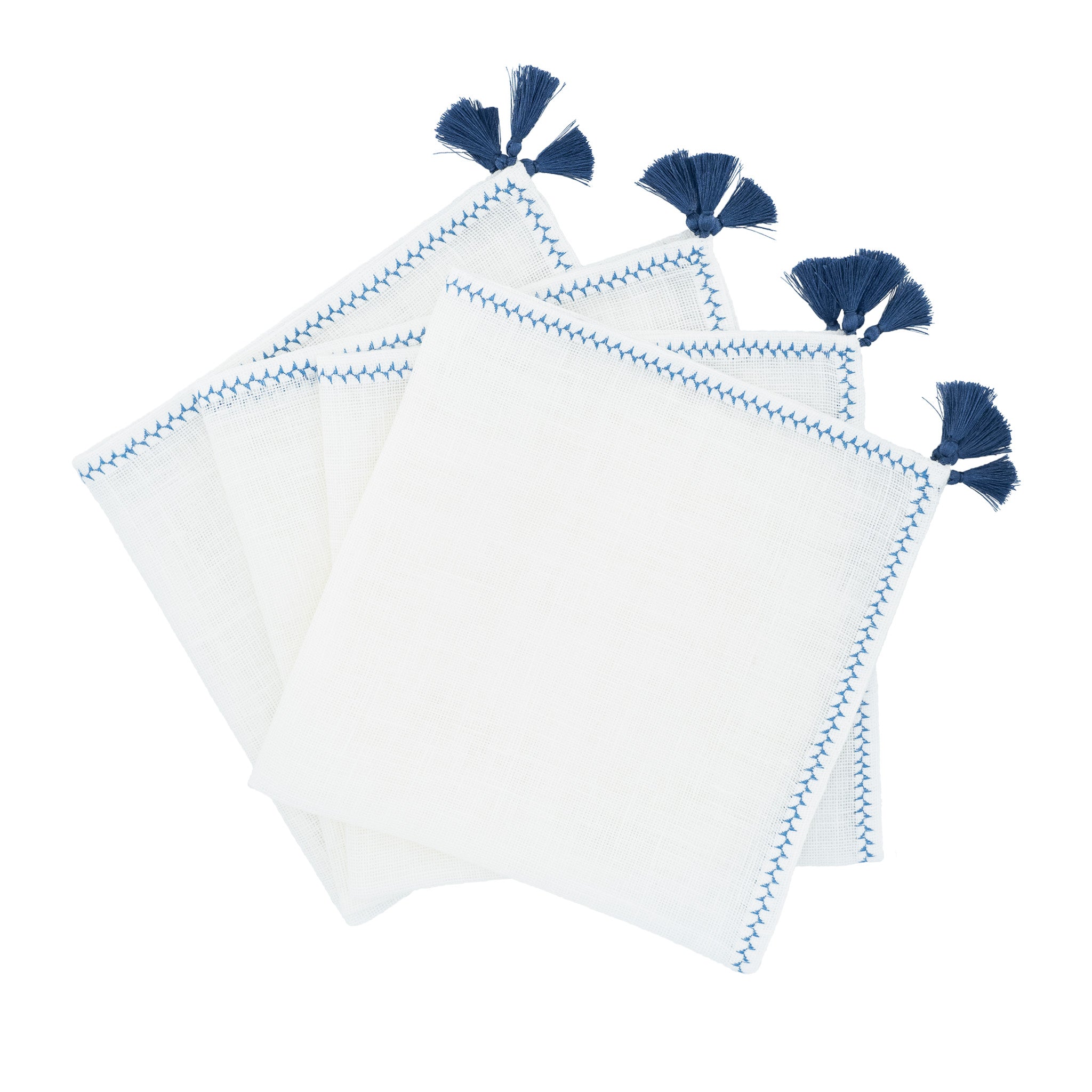 Set of 4 linen napkins with navy tassels, handcrafted to elevate your table setting with timeless elegance.