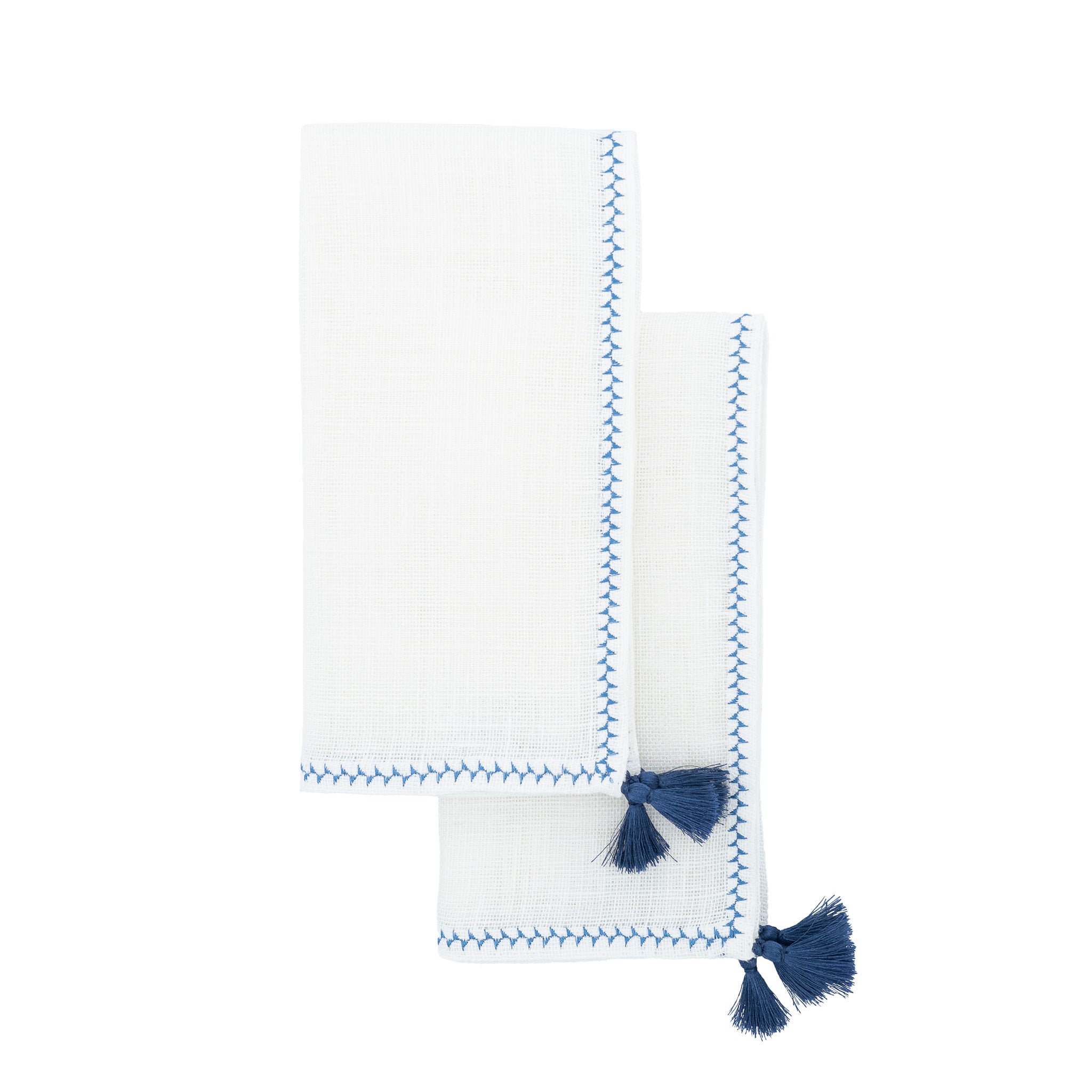 Handcrafted linen napkins with navy tassels, perfect for both formal dinner parties and casual family gatherings.