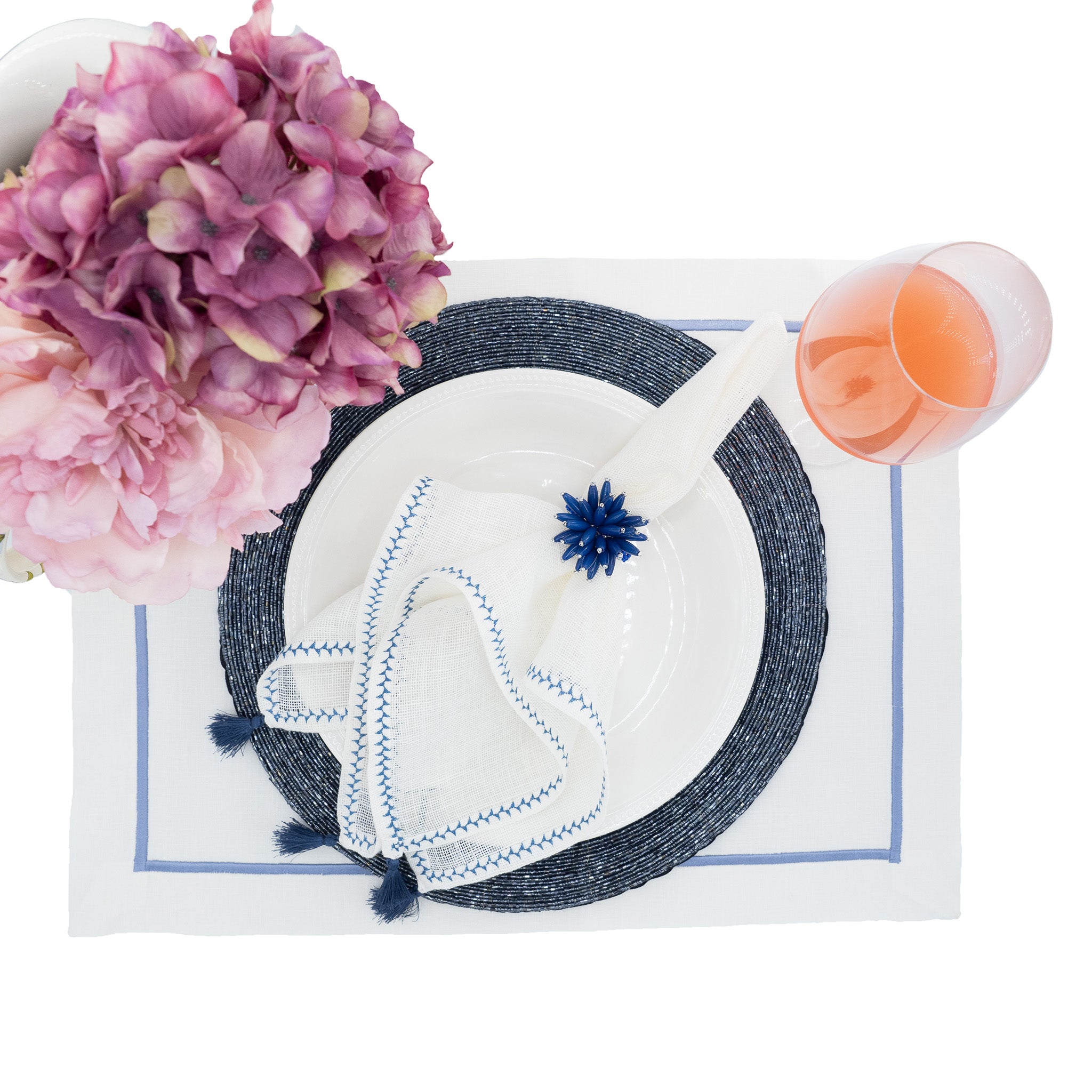 Premium linen napkins featuring soft navy tassels, enhancing the tactile experience of your meals.