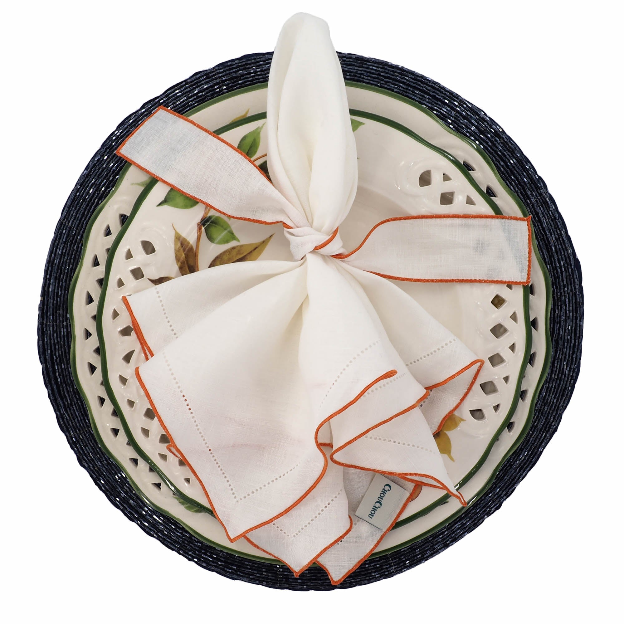 Set of 4 white linen napkins with orange ruffled hemstitch edges, handmade for a vibrant and elegant table setting.