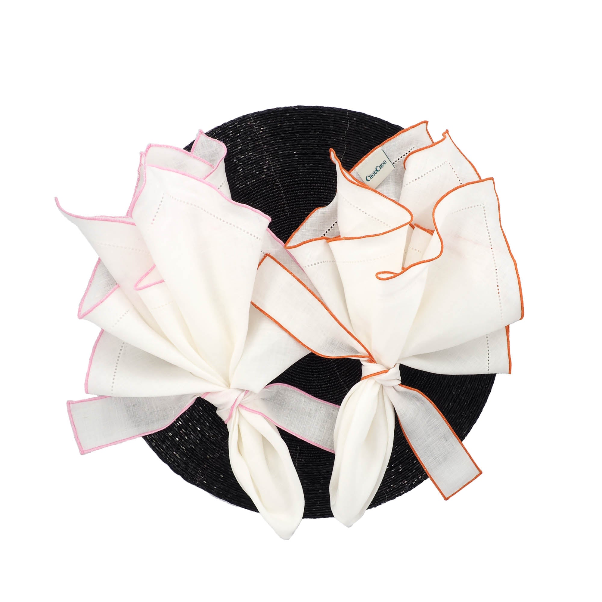 White linen napkin featuring orange ruffled hemstitch edges, crafted from 100% high-quality linen.