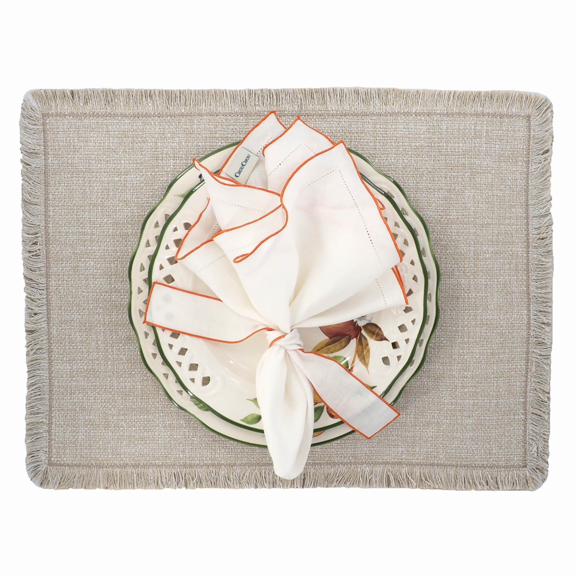 Chouchou Touch handmade white linen napkins with orange ruffled hemstitch edges, perfect for enhancing special occasions and everyday meals.