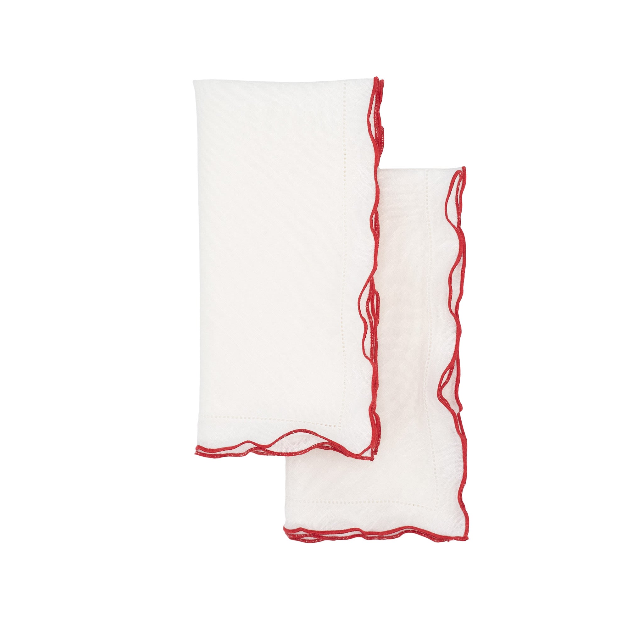 Elegant white linen napkins with red ruffled hemstitch detailing, handmade for lasting quality and tactile pleasure.