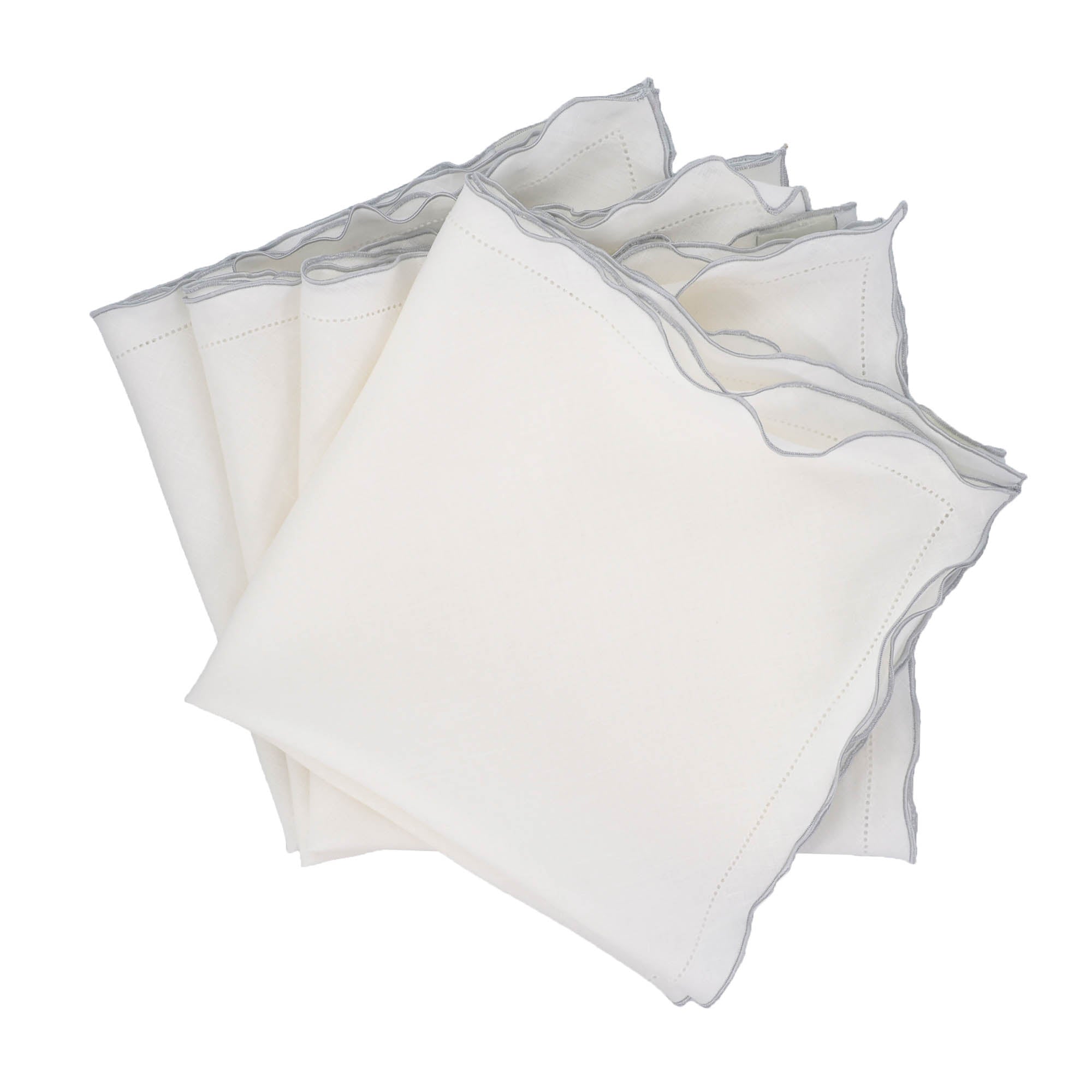 Set of 4 white linen napkins with silver ruffled hemstitch edges, handmade for an elegant and sophisticated table setting.