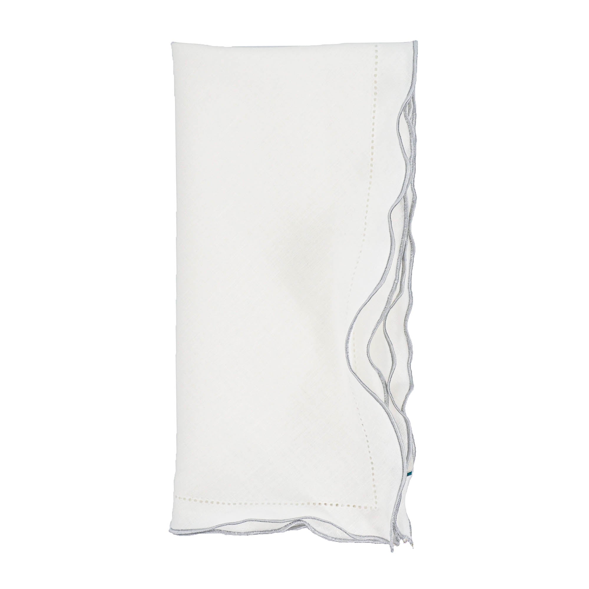 Handmade white linen napkins with decorative silver ruffled hemstitch edges, perfect for formal events and casual gatherings.