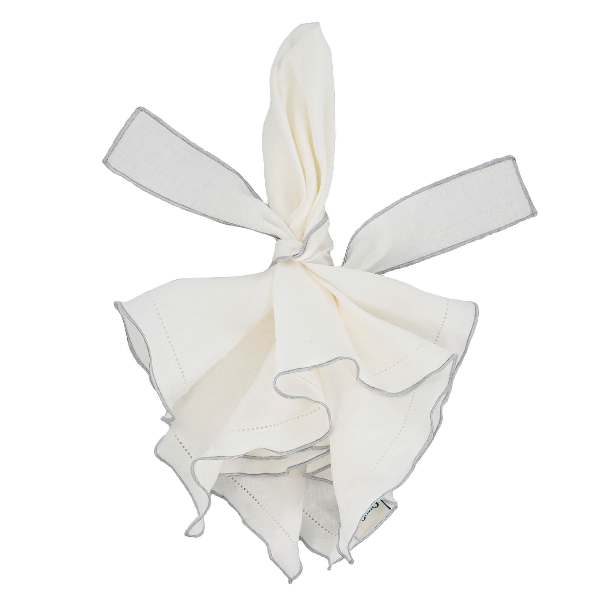 Set of 4 white linen napkins, 21x21 inches, with silver ruffled hemstitch edges for a chic dining experience.