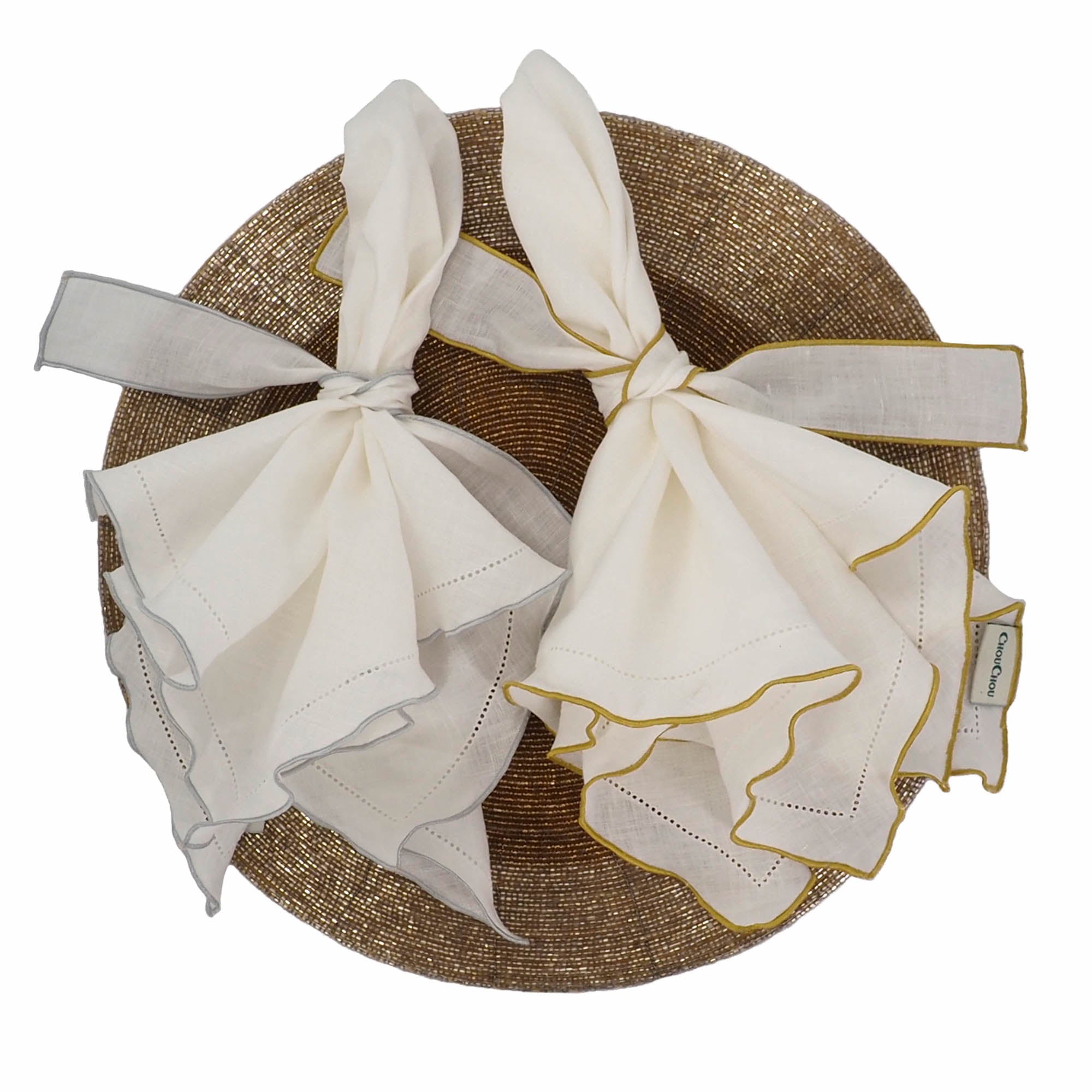 Chouchou Touch handmade white linen napkins with silver ruffled hemstitch edges, perfect for enhancing special occasions and everyday meals.