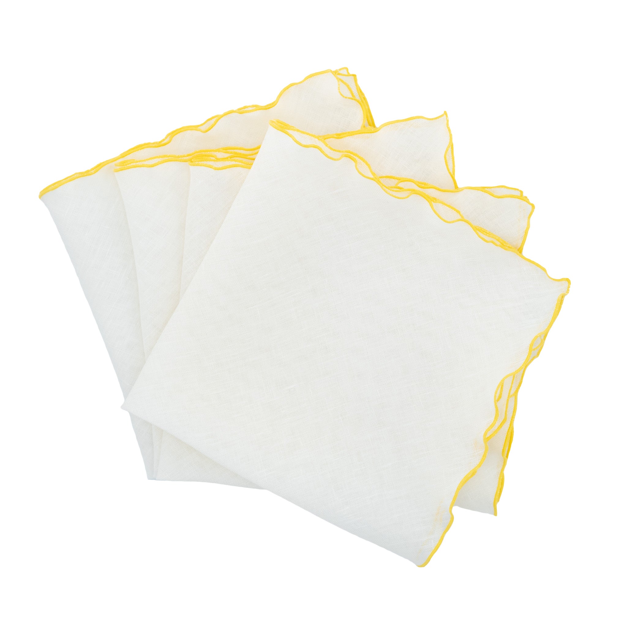 Handmade linen napkins with yellow ruffled edges, perfect for casual gatherings and formal events alike.