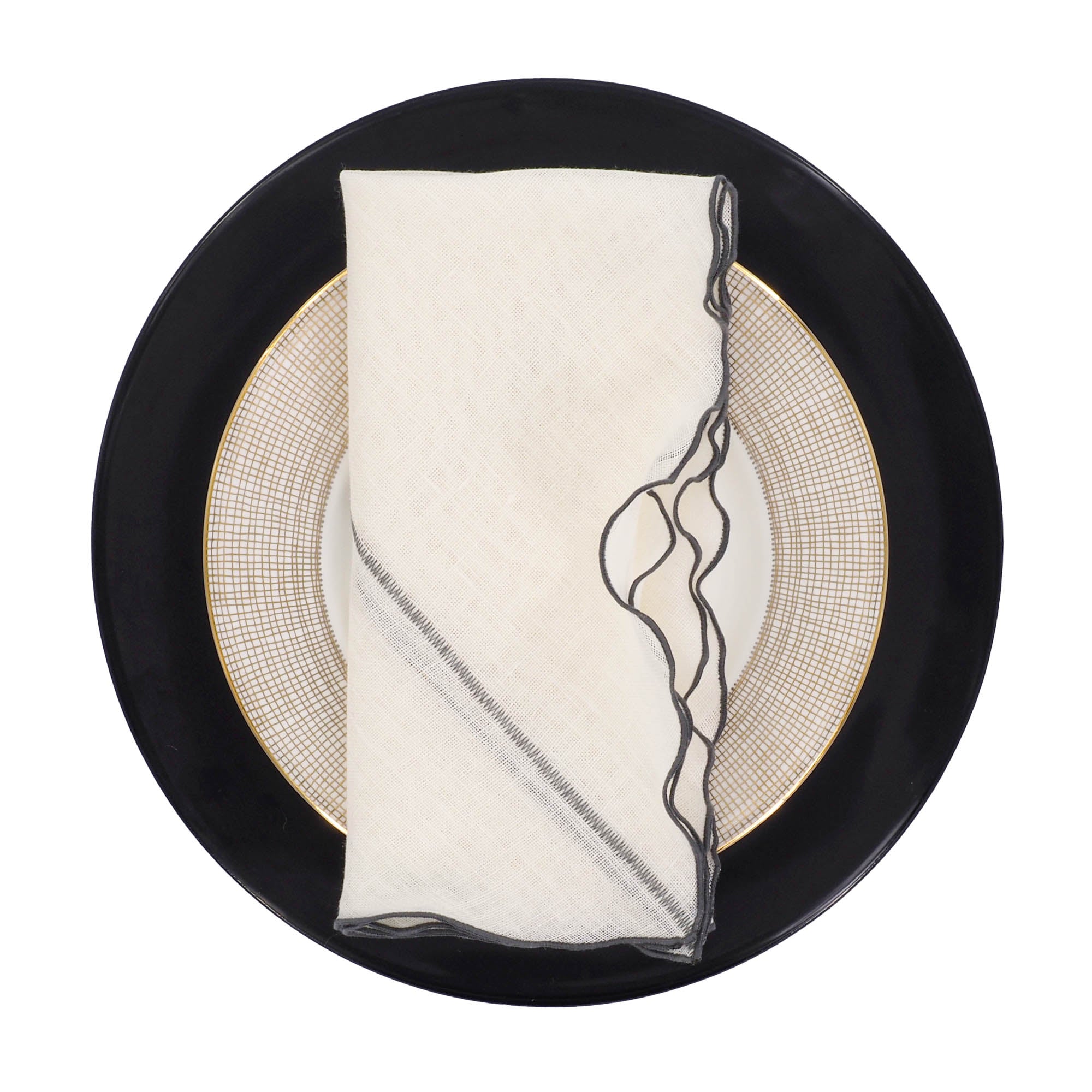 Elegant Milano linen napkins with charcoal ruffled edges, handmade from durable linen for long-lasting quality.