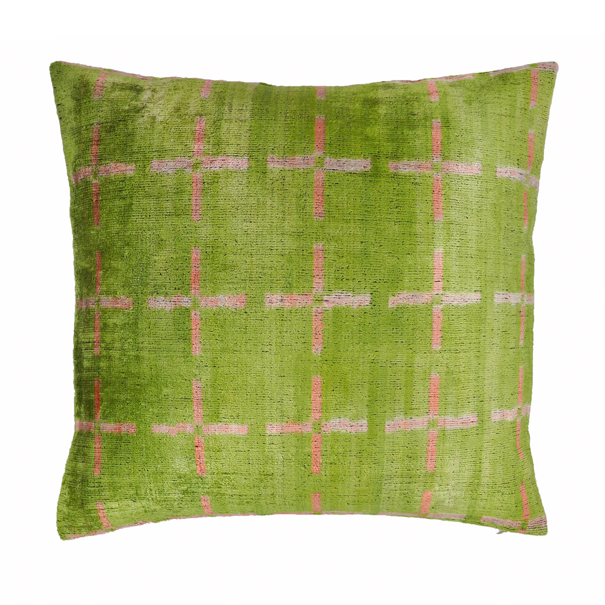 Handmade silk velvet pillow cover with vibrant Ikat patterns, inspired by centuries-old weaving traditions.
