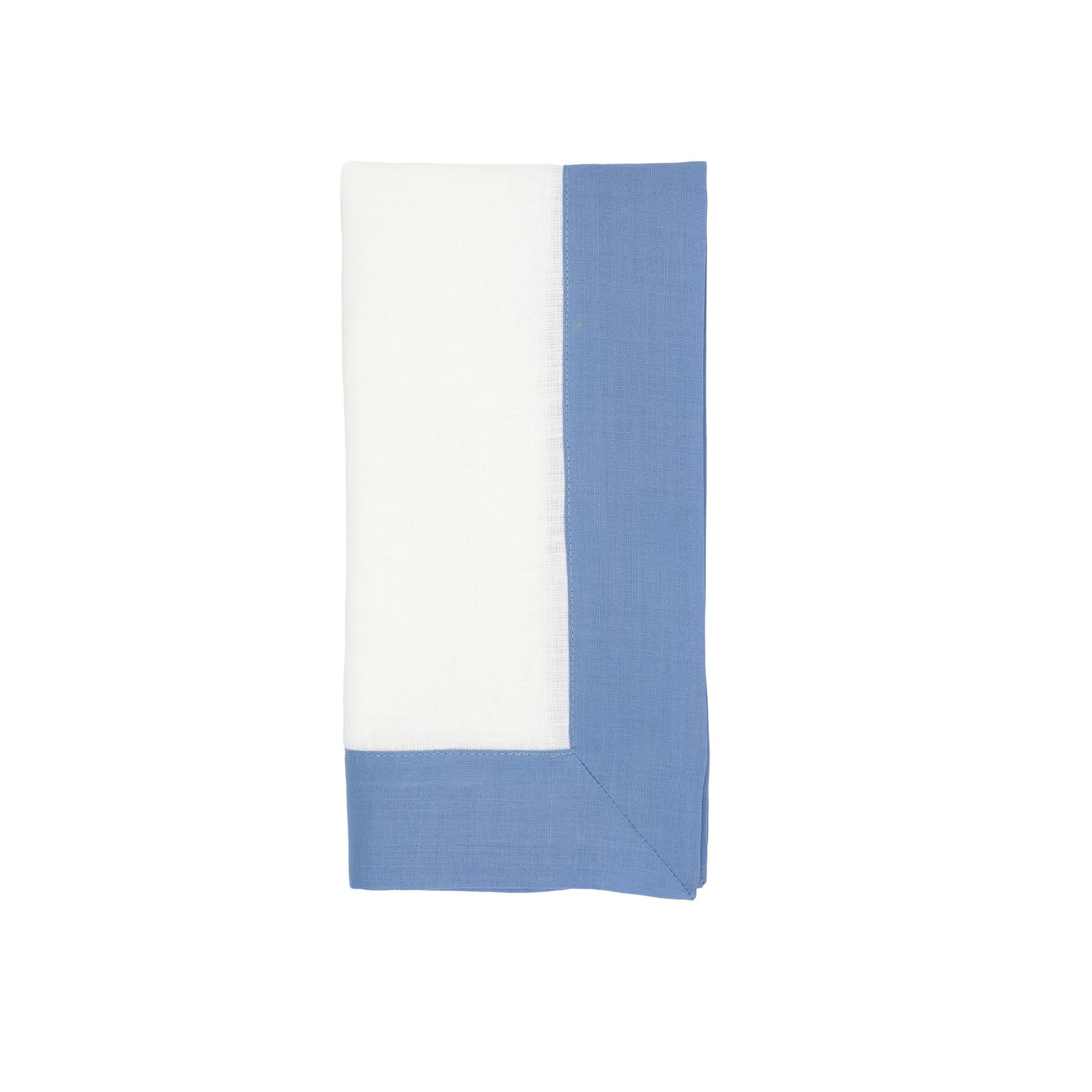 Set of 4 sky white linen napkins, 21x21 inches, with blue borders for a modern, sophisticated tabletop.