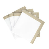 white linen napkins with gold sparkle borders