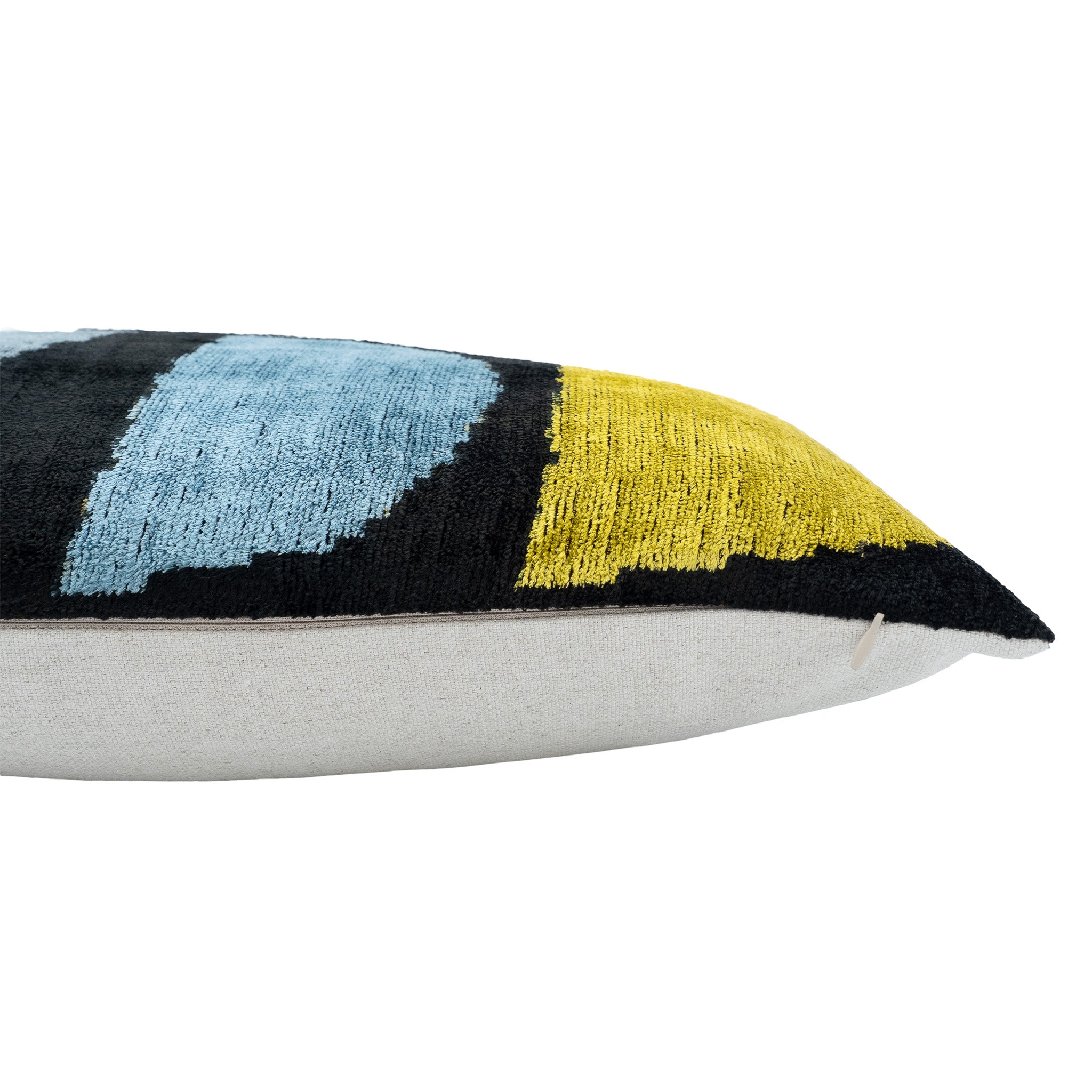 Bold and vibrant Eye of Ra Ikat throw pillow cover, 16" x 24", made with smooth silk velvet for timeless style.
