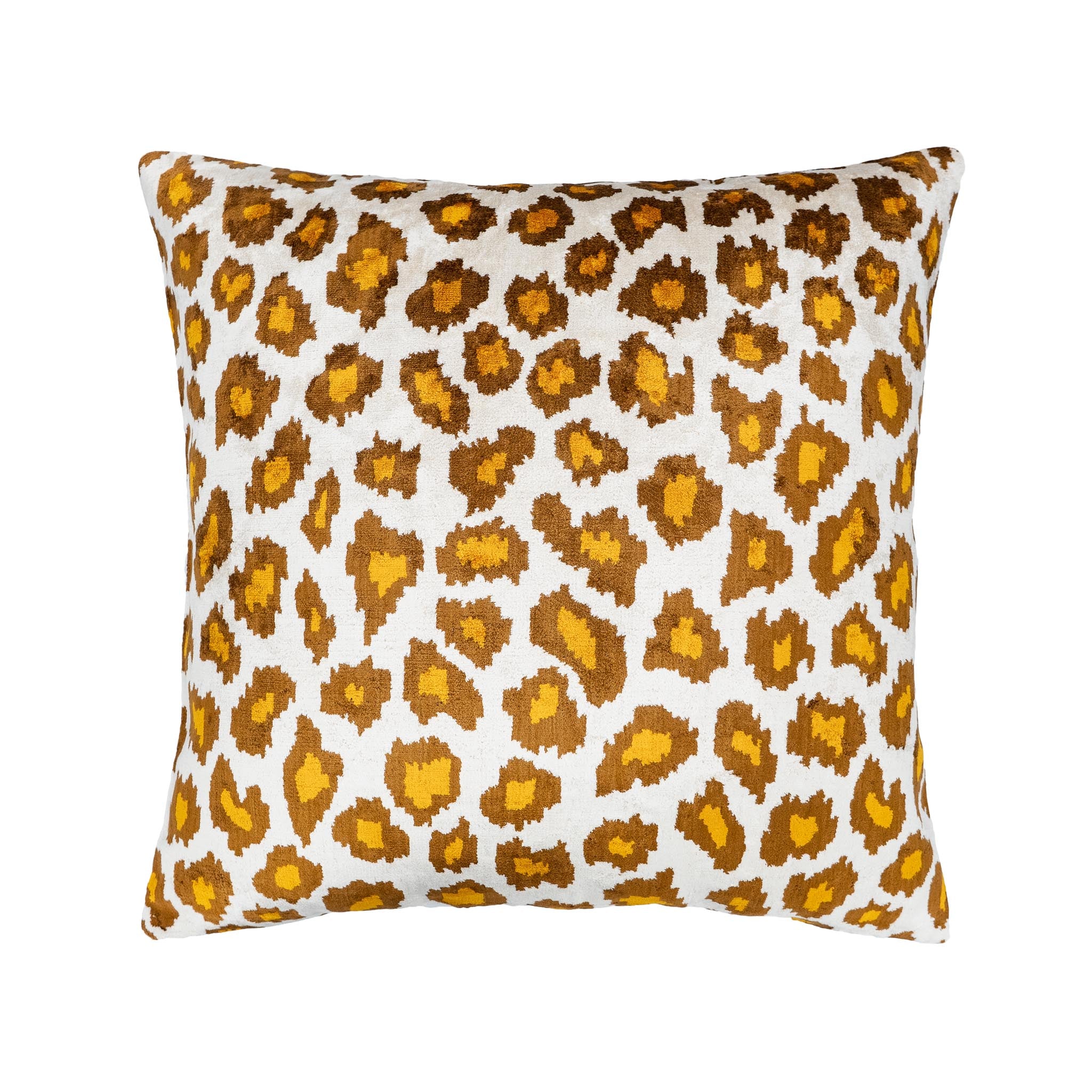 Square silk velvet pillow in bold leopard ikat pattern, brown and yellow on ivory.