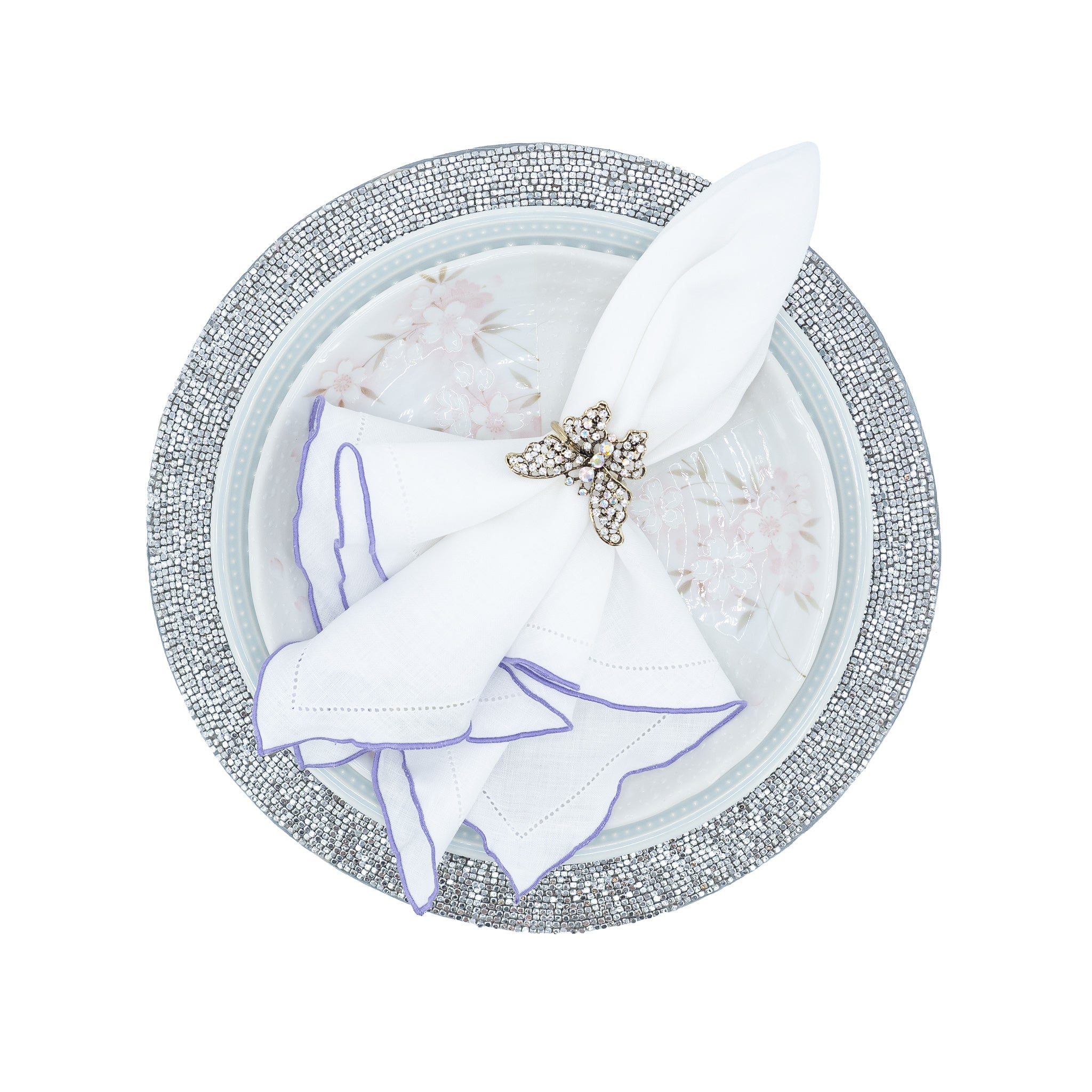 Chouchou Touch handmade white linen napkins with purple ruffled hemstitch edges, perfect for special occasions and everyday meals.