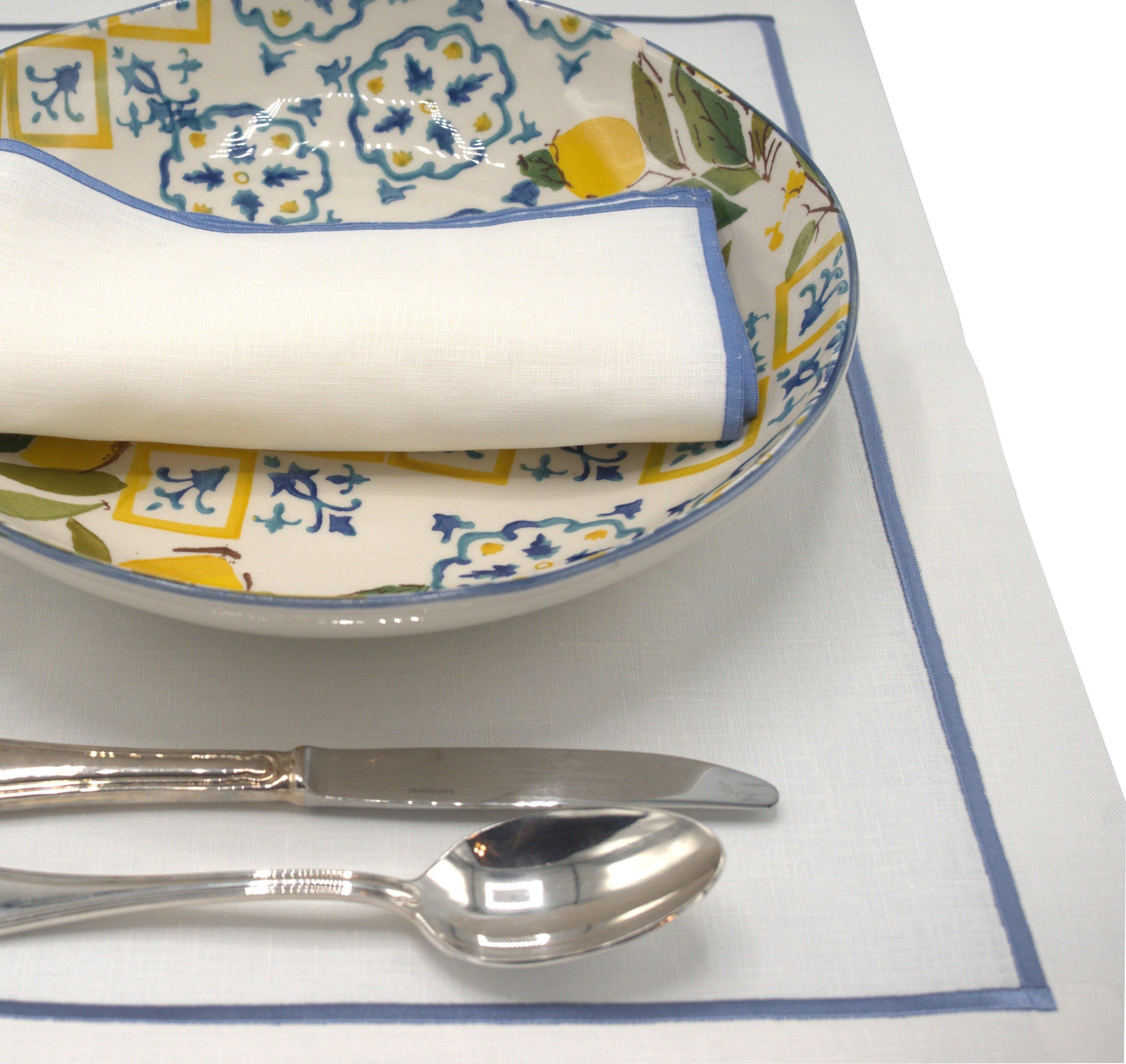 Chouchou Touch linen placemats with blue stitched borders, made to last and add style to your dining experience.