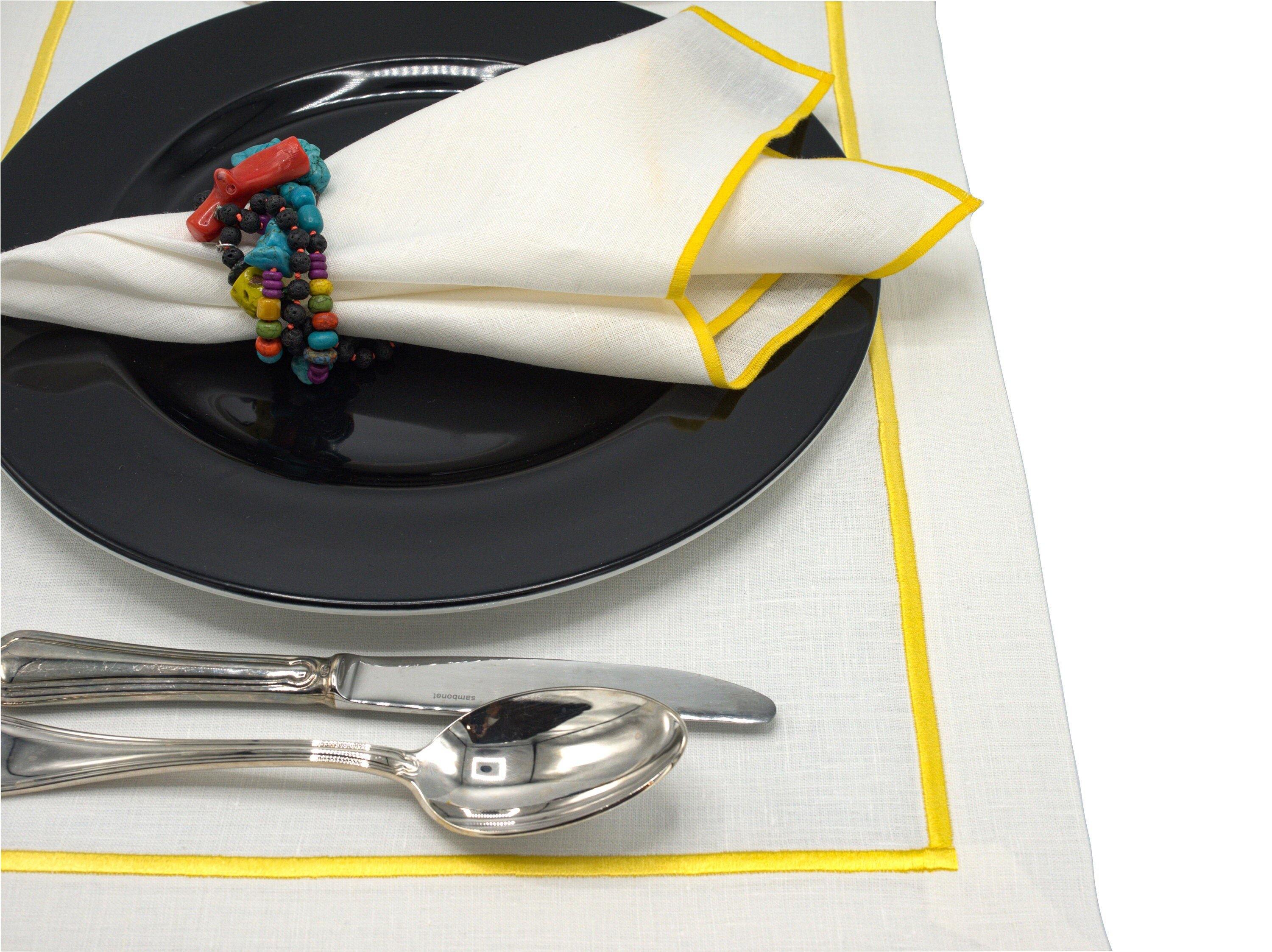 Elegant linen placemats with yellow borders, set of 4, perfect for both casual family meals and formal gatherings.