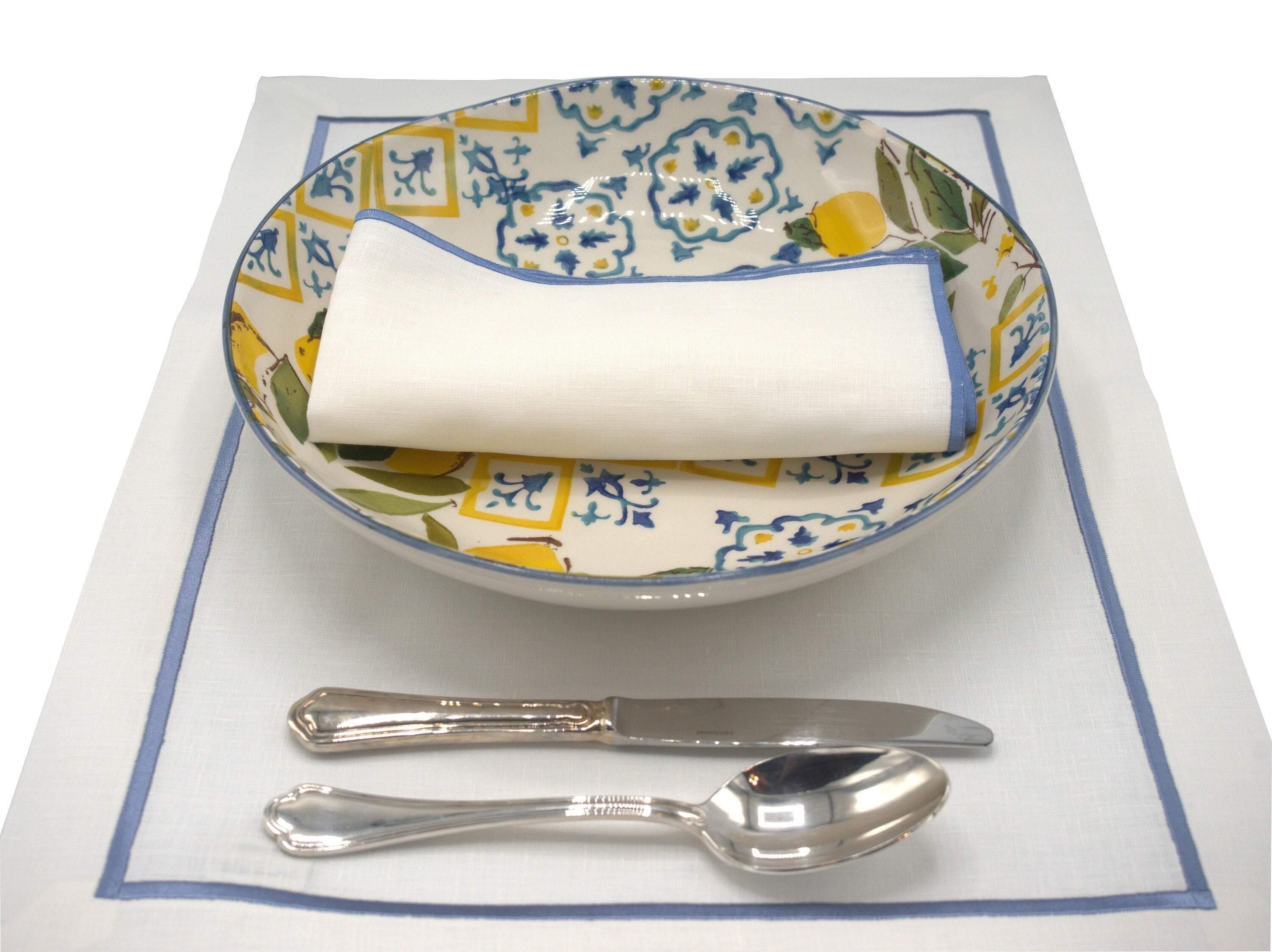 Elegant blue-bordered linen placemats, set of 4, perfect for any special occasion or everyday dining.